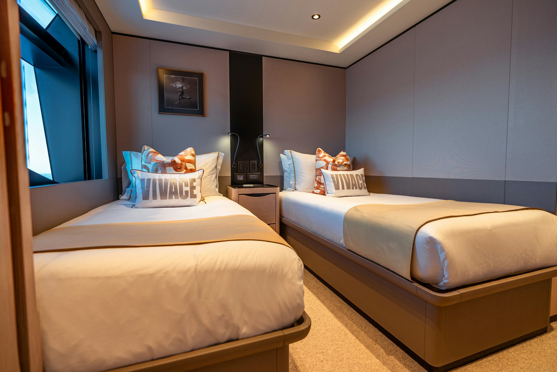 a room with two beds aboard VIVACE Yacht for Charter
