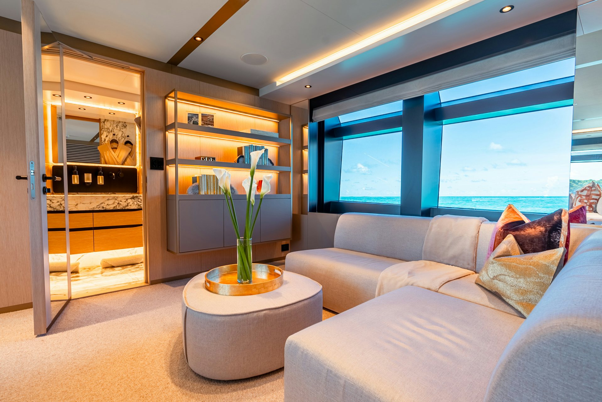 a living room with a large glass door aboard VIVACE Yacht for Charter