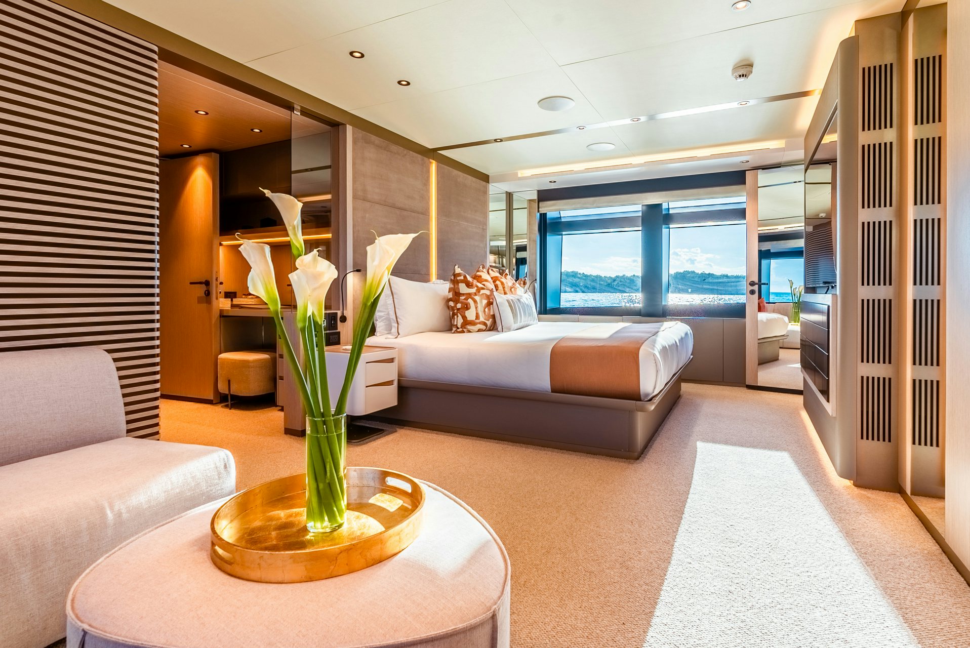 a living room with a large window aboard VIVACE Yacht for Charter