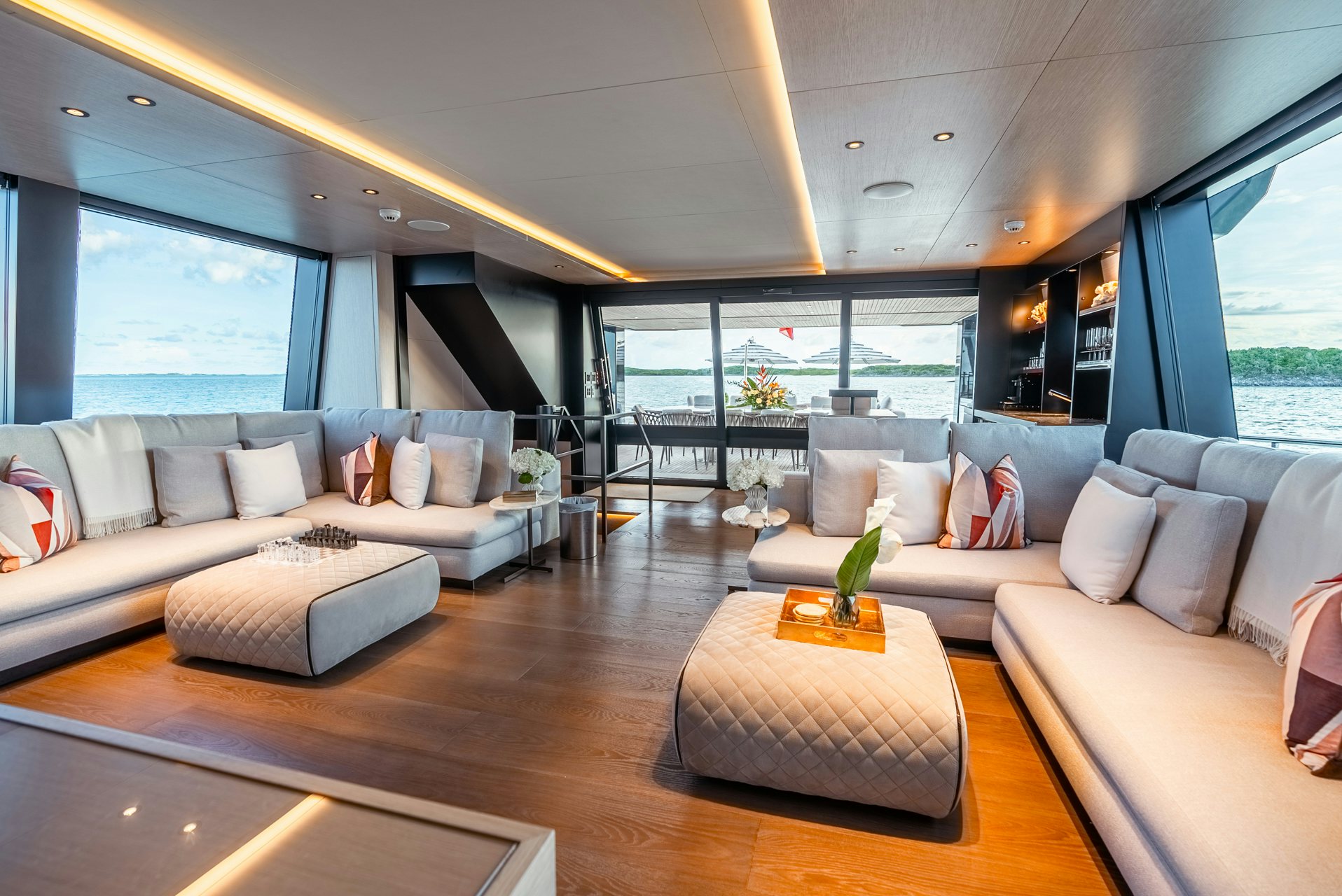 a living room with a large window aboard VIVACE Yacht for Charter