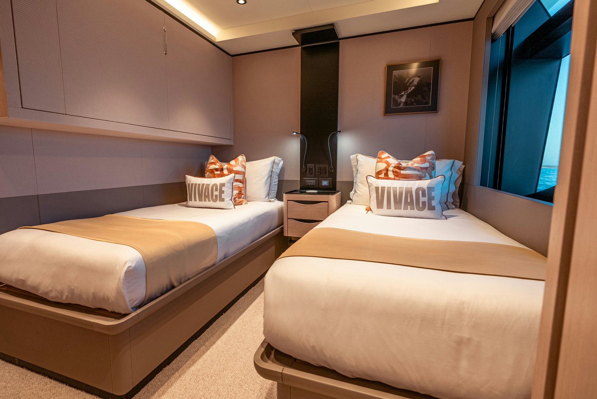 a room with two beds aboard VIVACE Yacht for Charter