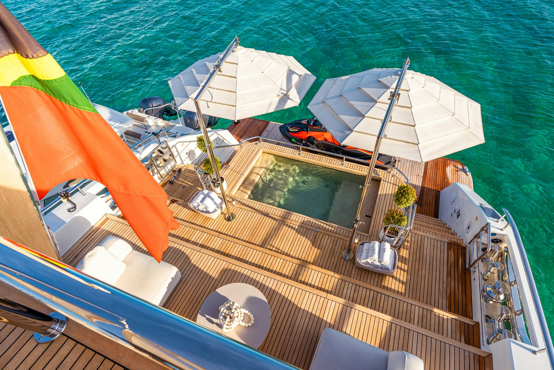 a boat with umbrellas on it aboard VIVACE Yacht for Charter