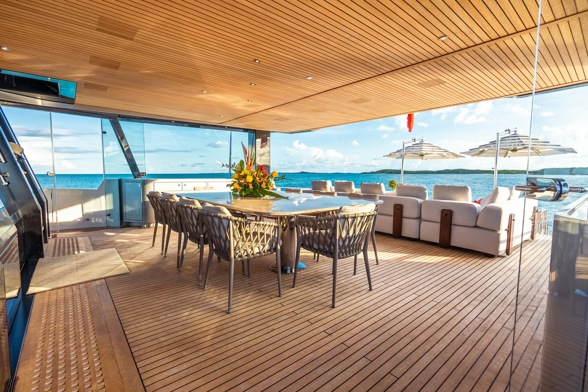 a room with a table and chairs aboard VIVACE Yacht for Charter
