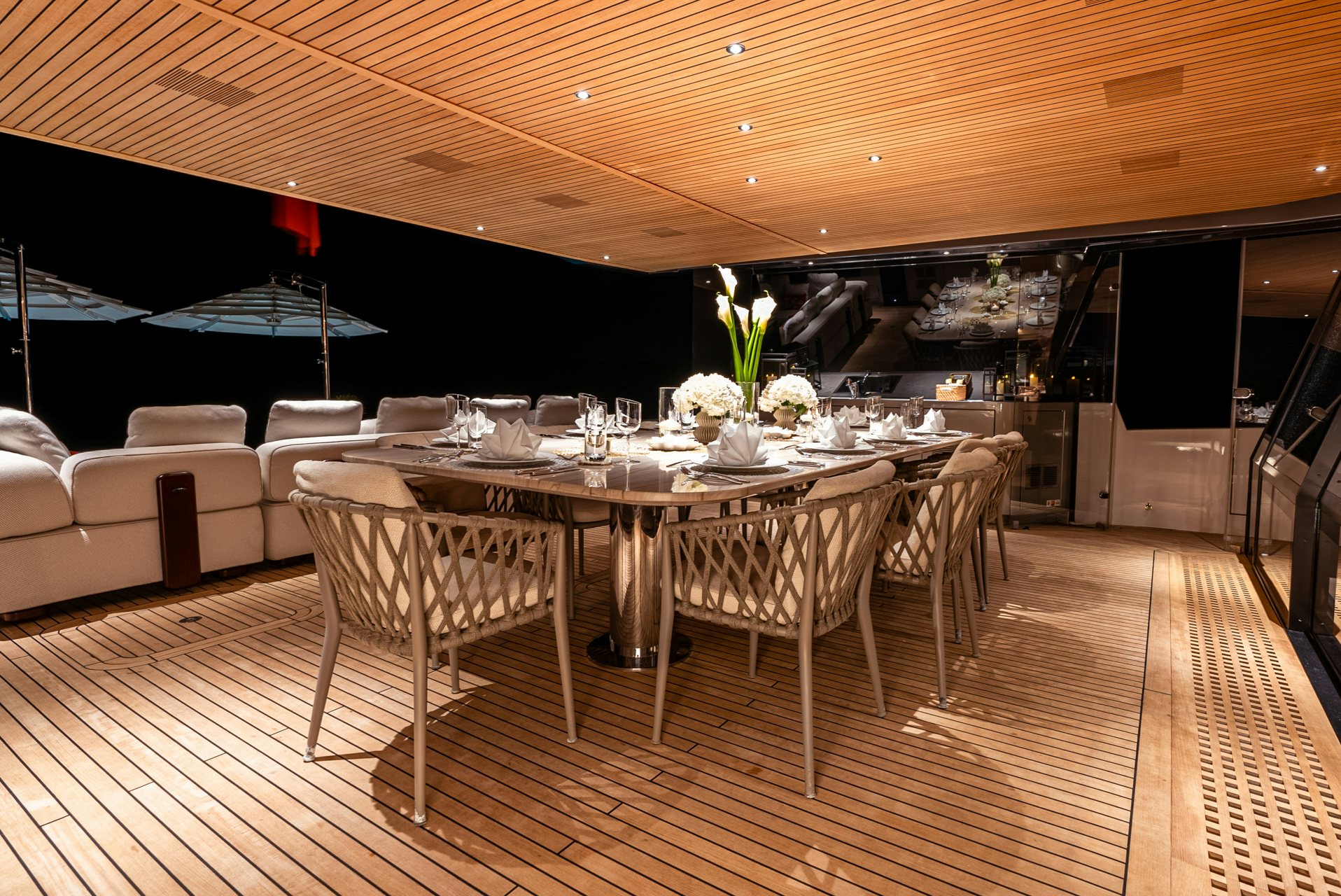 a room with a table and chairs aboard VIVACE Yacht for Charter