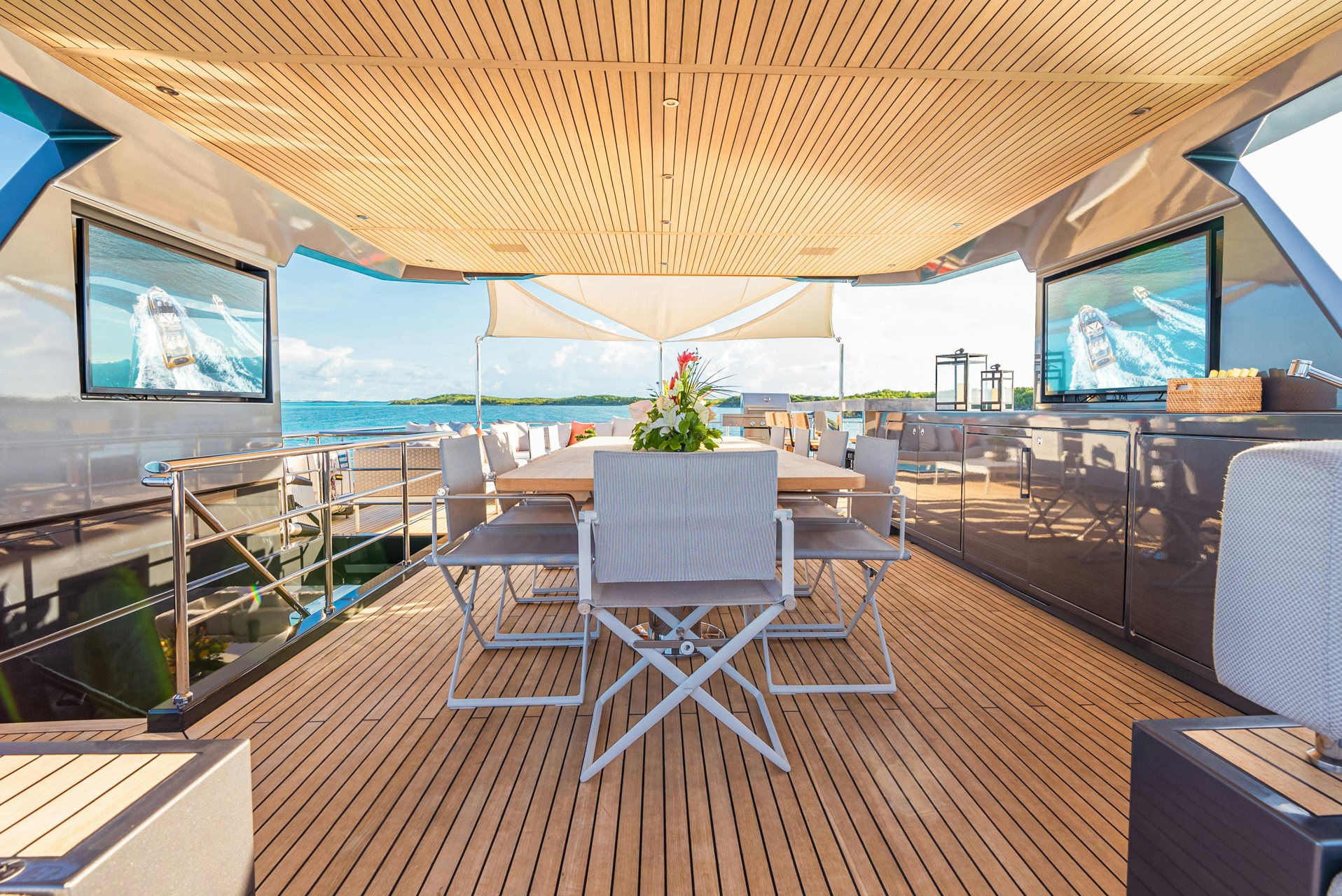 a room with a table and chairs aboard VIVACE Yacht for Charter