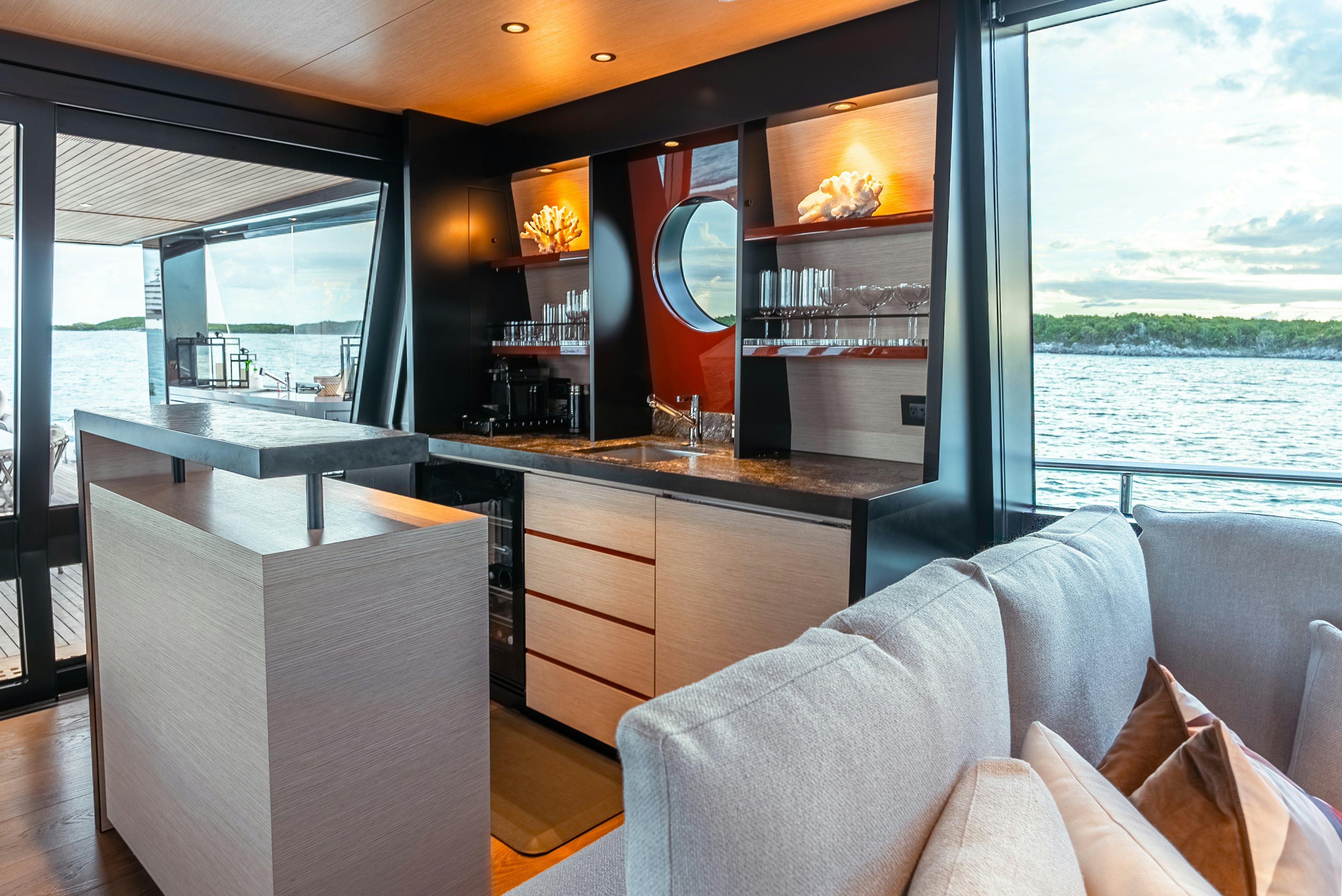 a room with a view of a city and a large window aboard VIVACE Yacht for Charter