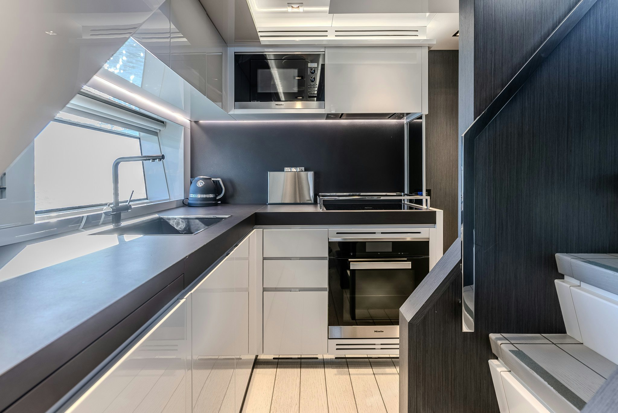 a kitchen with a stove and oven aboard CADET V Yacht for Sale