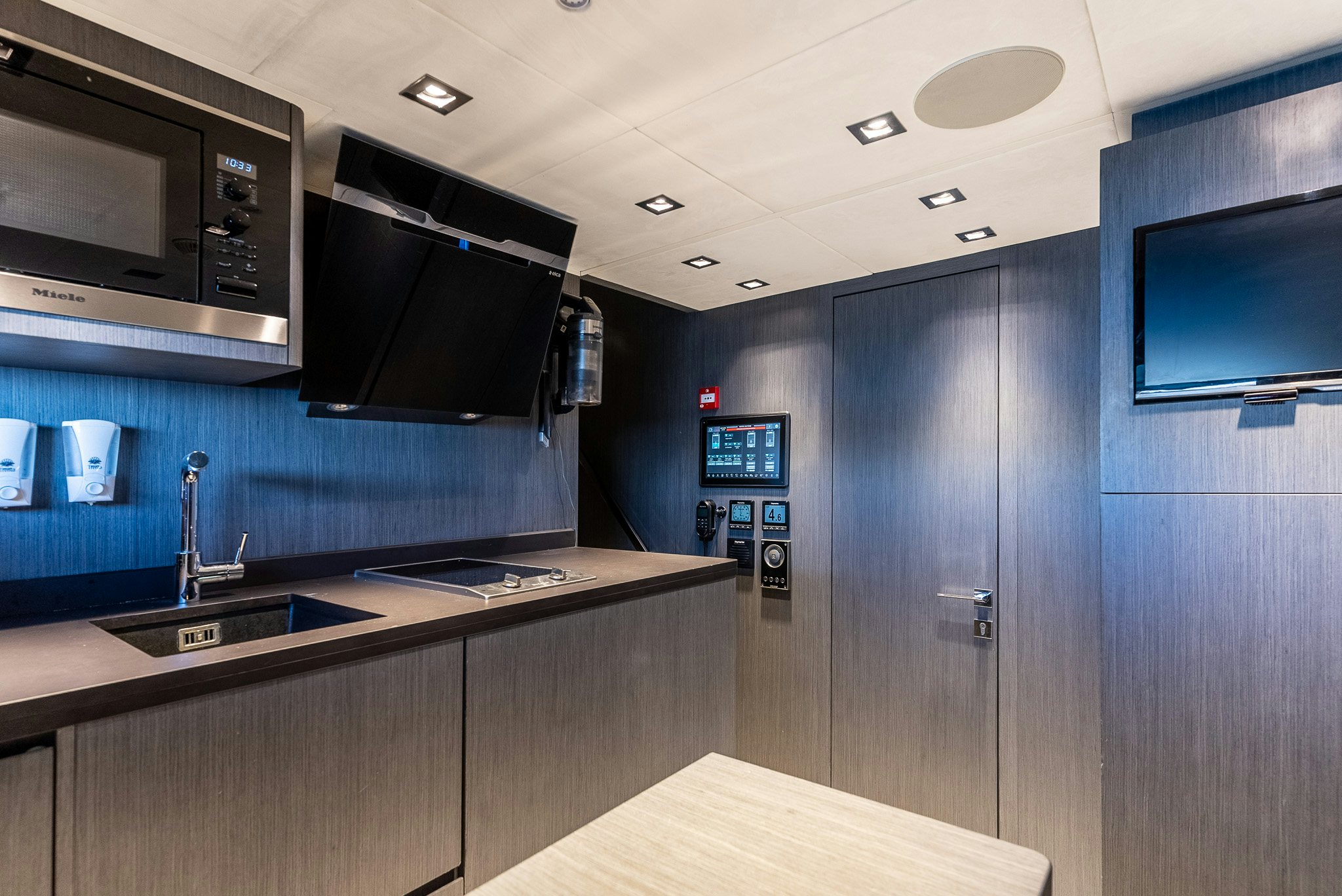 a kitchen with a sink and cabinets aboard CADET V Yacht for Sale