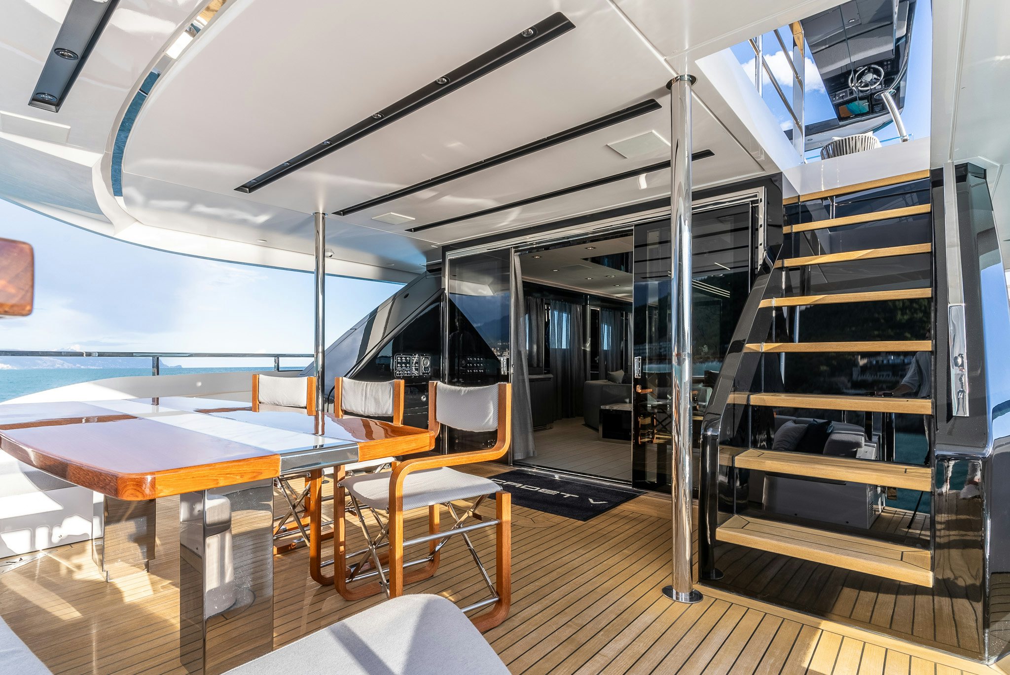 a room with a table and chairs aboard CADET V Yacht for Sale