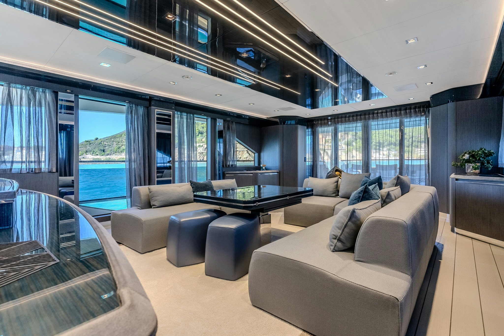 a living room with a large window aboard CADET V Yacht for Sale