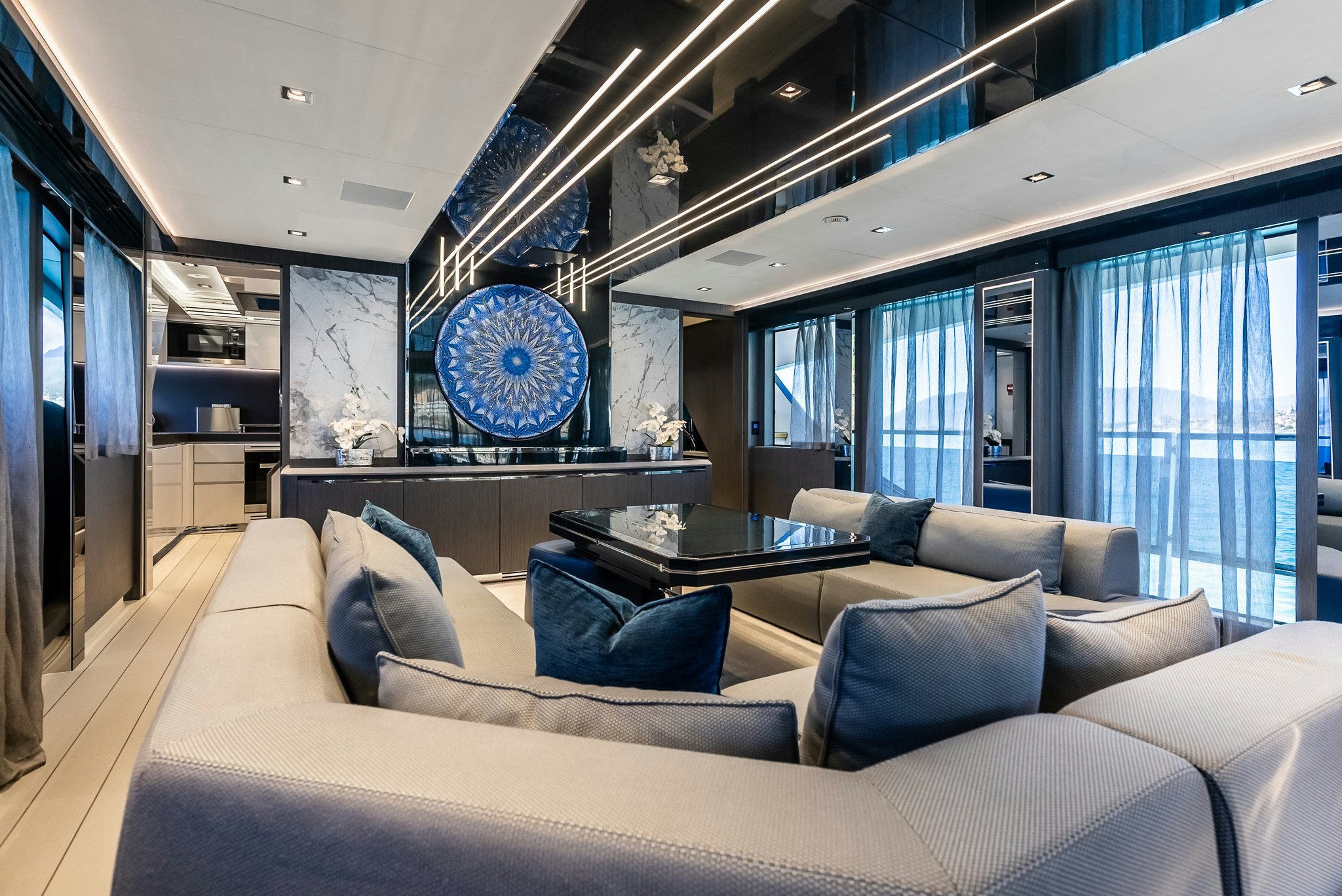 a large living room with a large window aboard CADET V Yacht for Sale