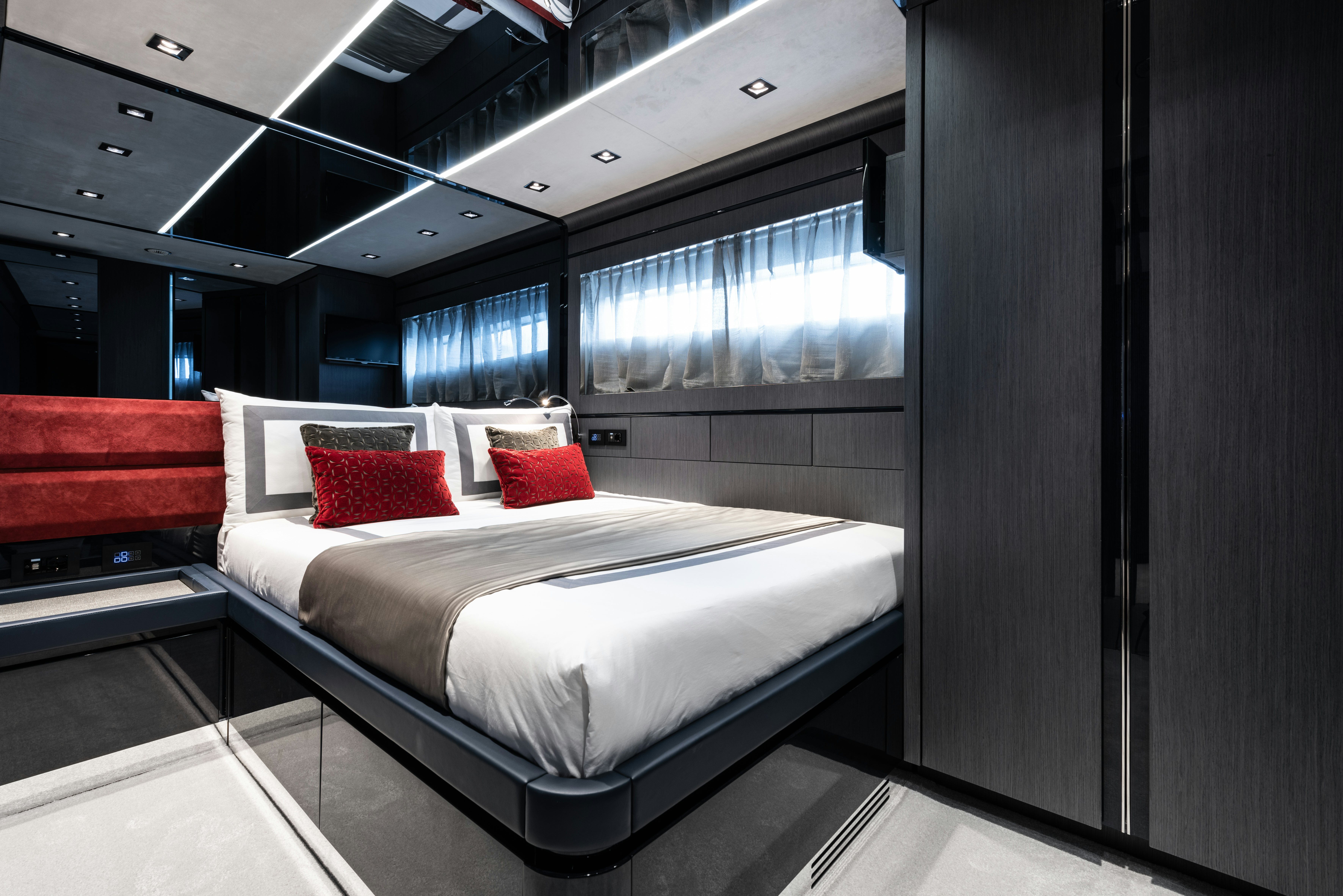 a room with a bed and a window aboard CADET V Yacht for Sale