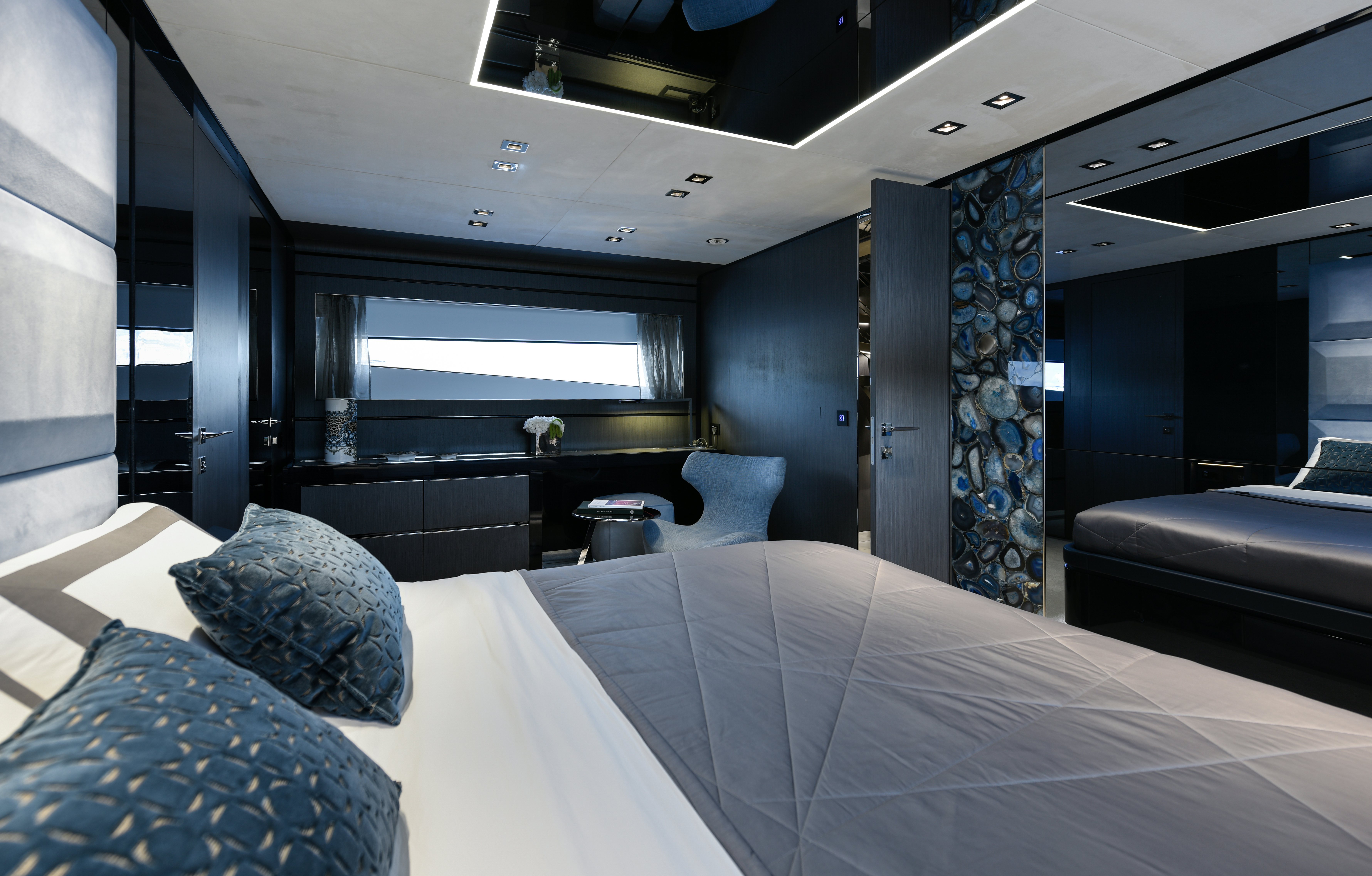 a room with a bed and a couch aboard CADET V Yacht for Sale