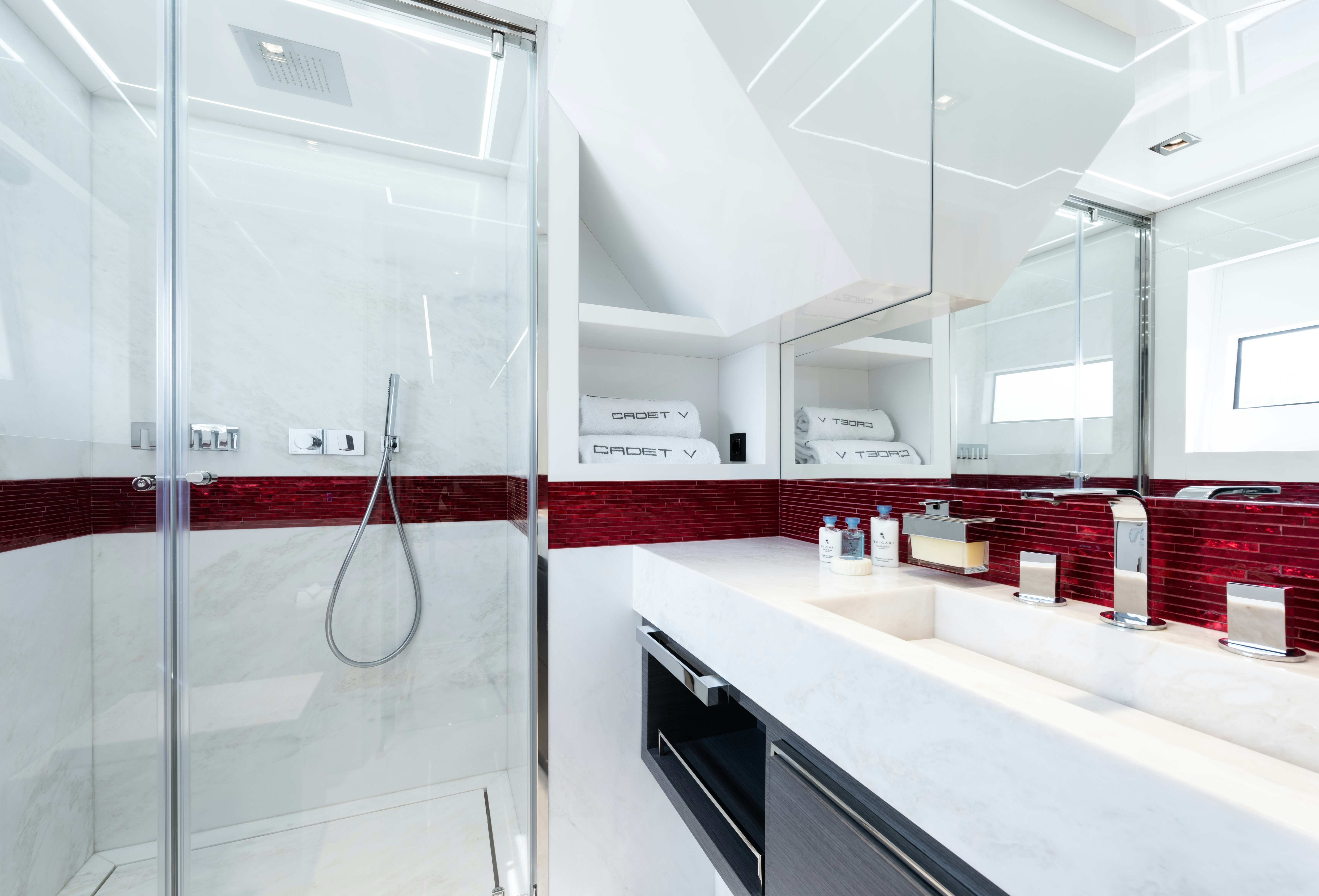 a room with a large glass shower aboard CADET V Yacht for Sale