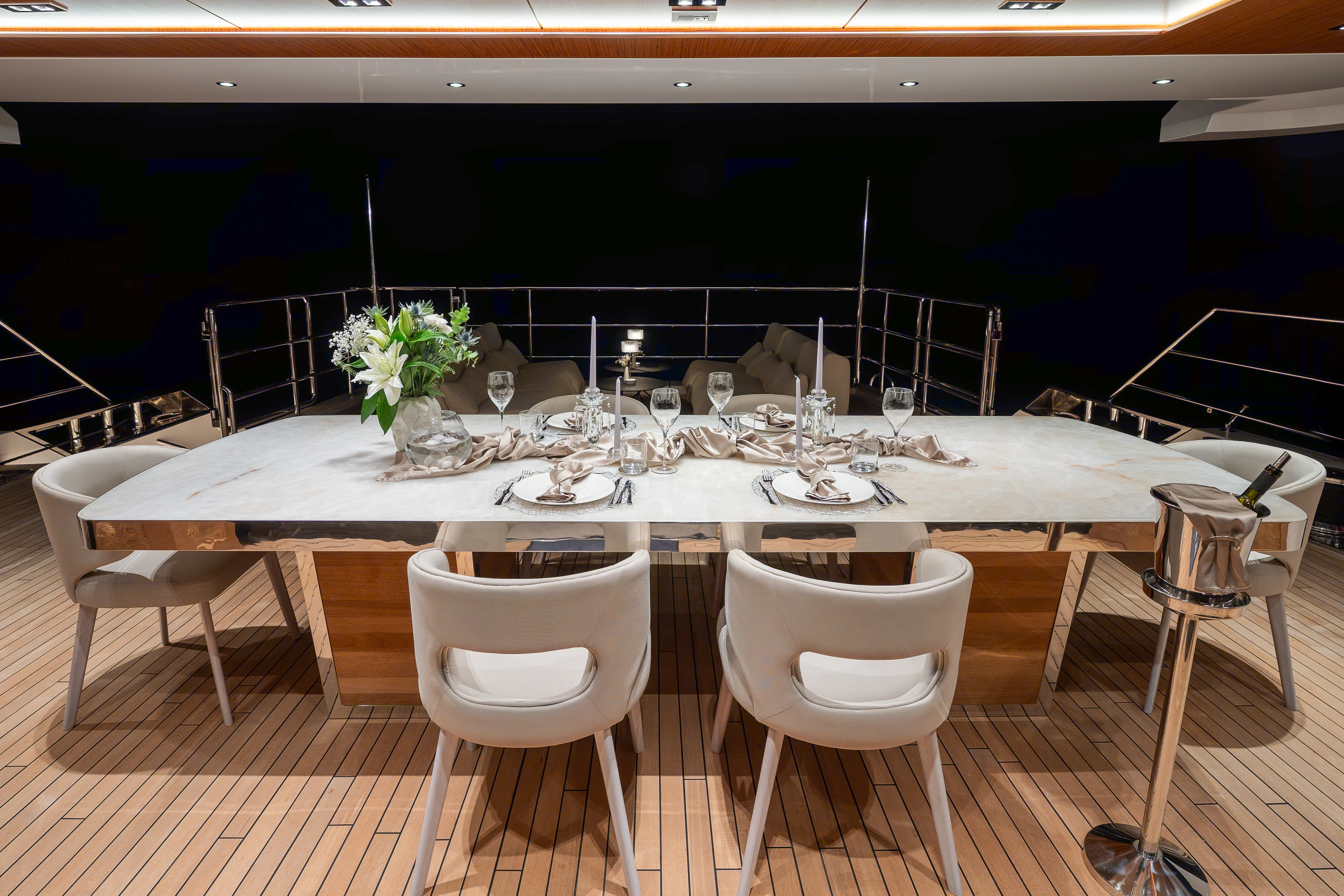 a table set for a dinner party aboard RENATA Yacht for Charter