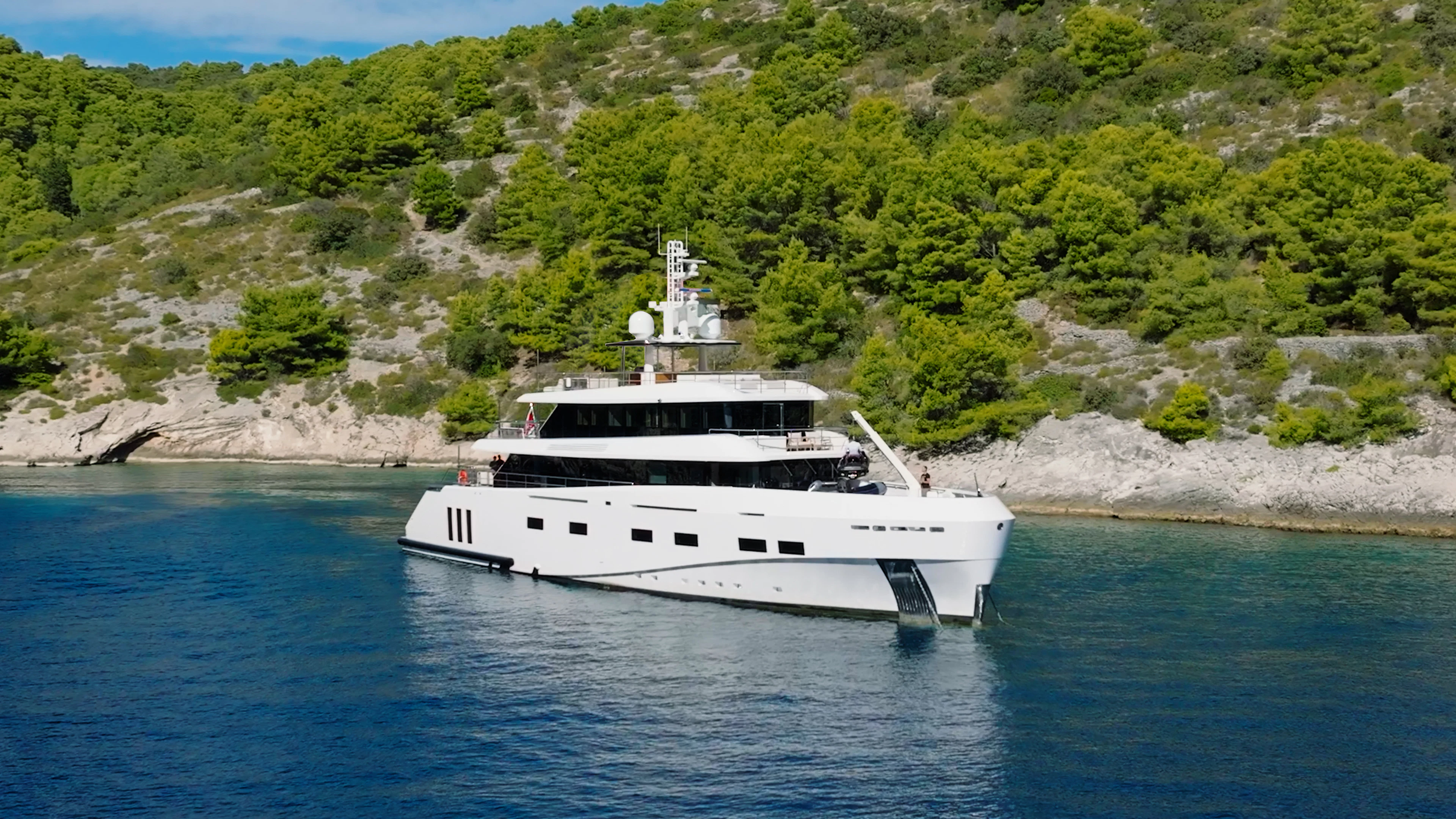a white boat in the water aboard RENATA Yacht for Charter