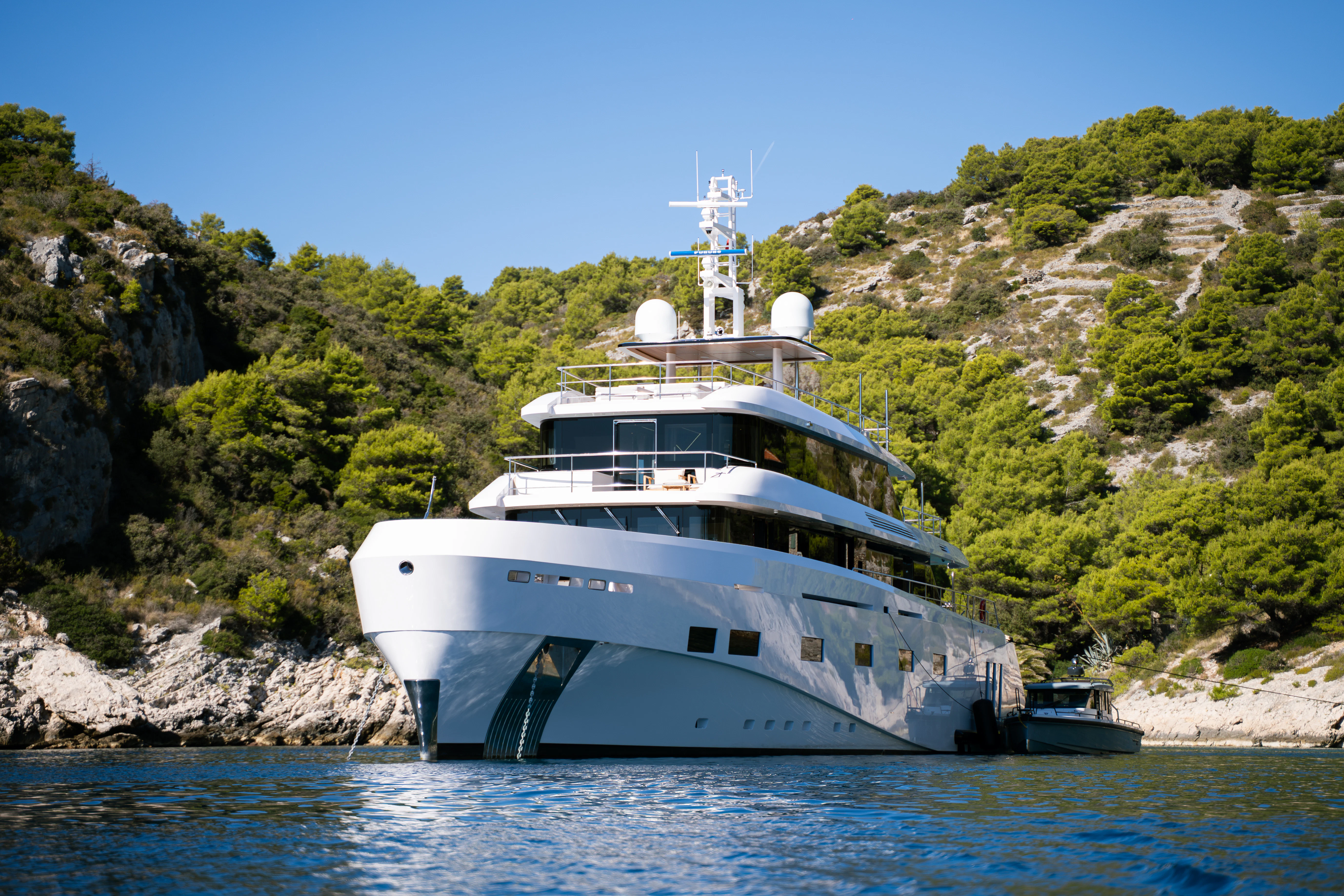 a large white boat in the water aboard RENATA Yacht for Charter