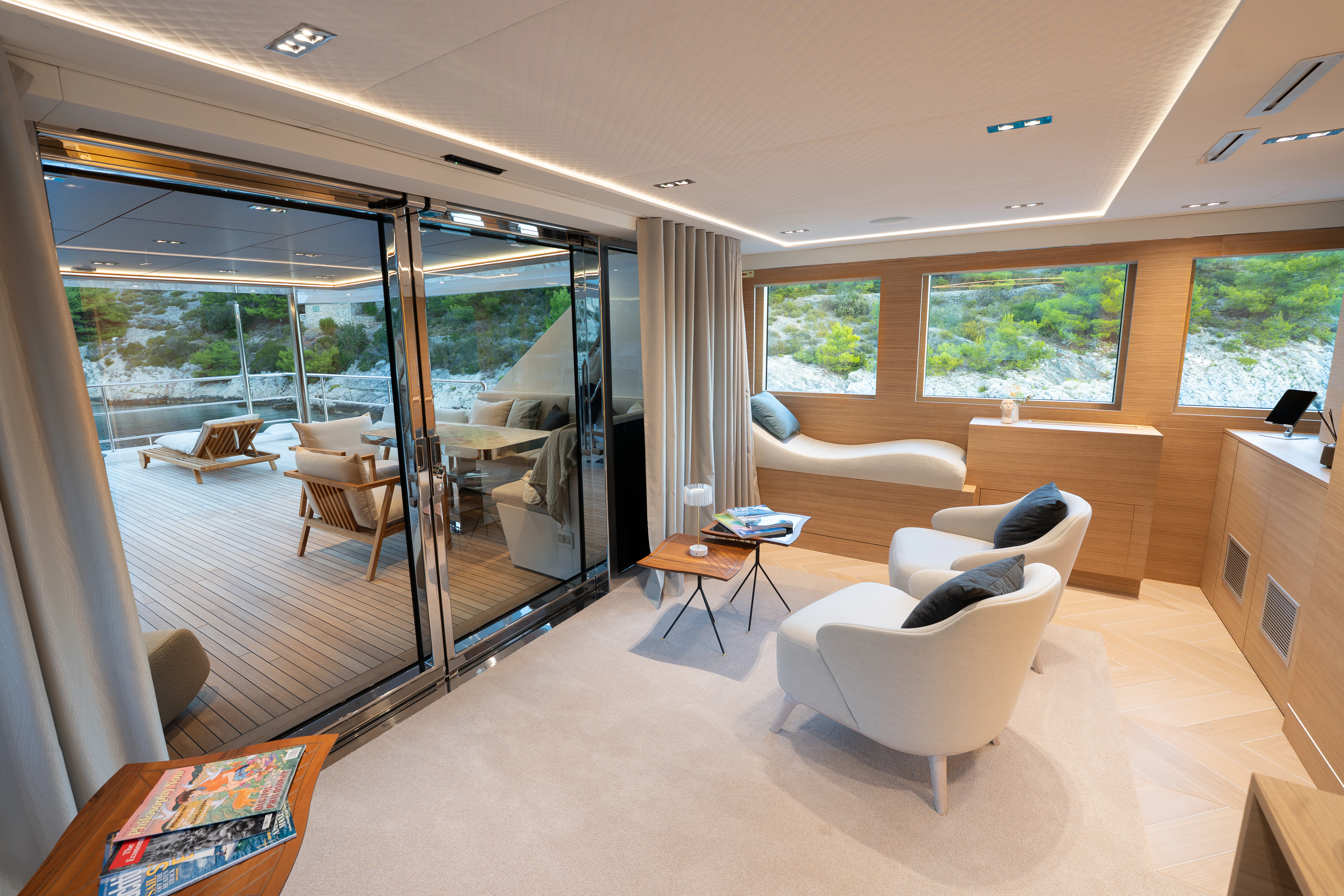 a living room with a glass door aboard RENATA Yacht for Charter