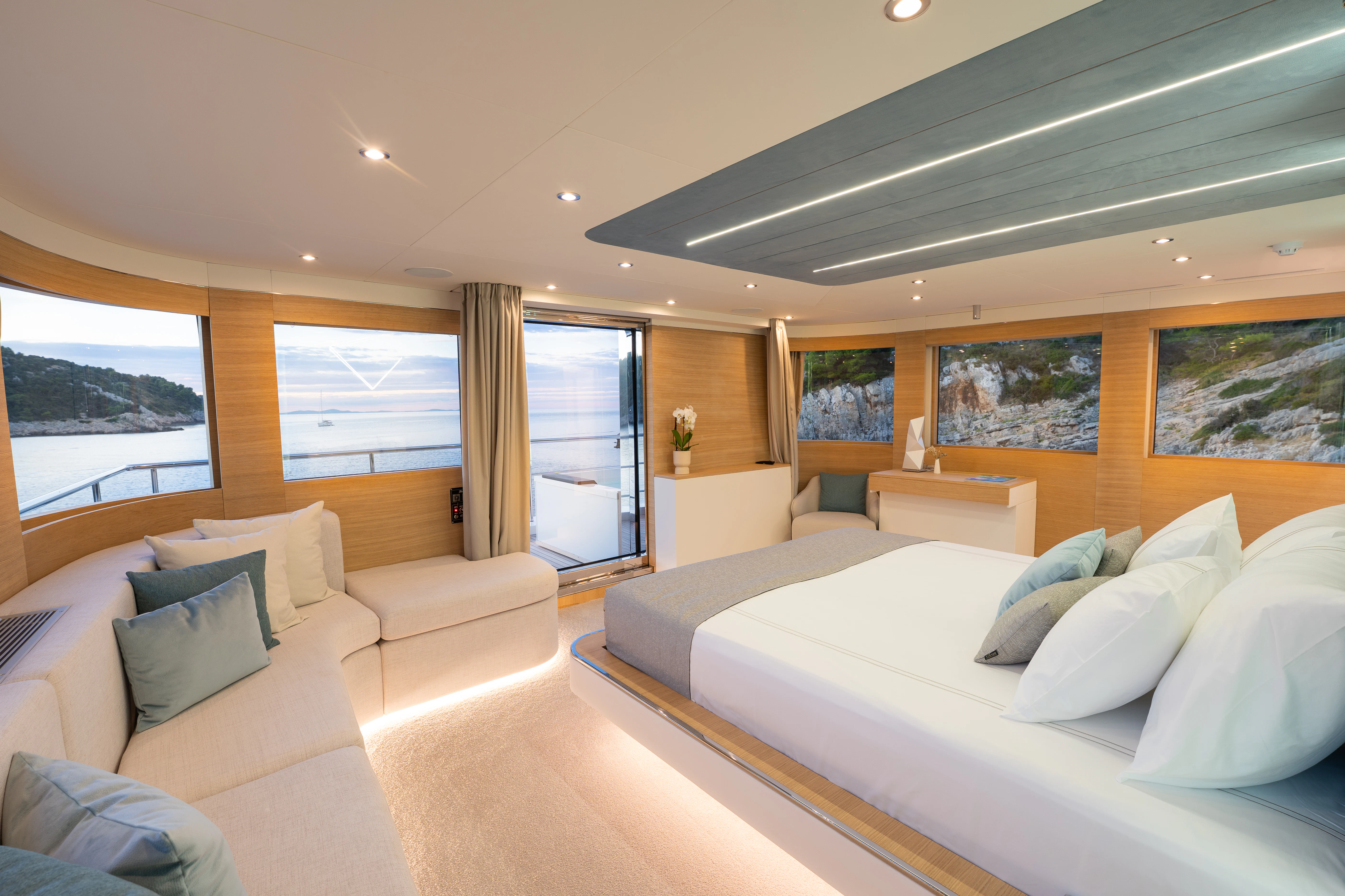 a room with a couch and a bed aboard RENATA Yacht for Charter
