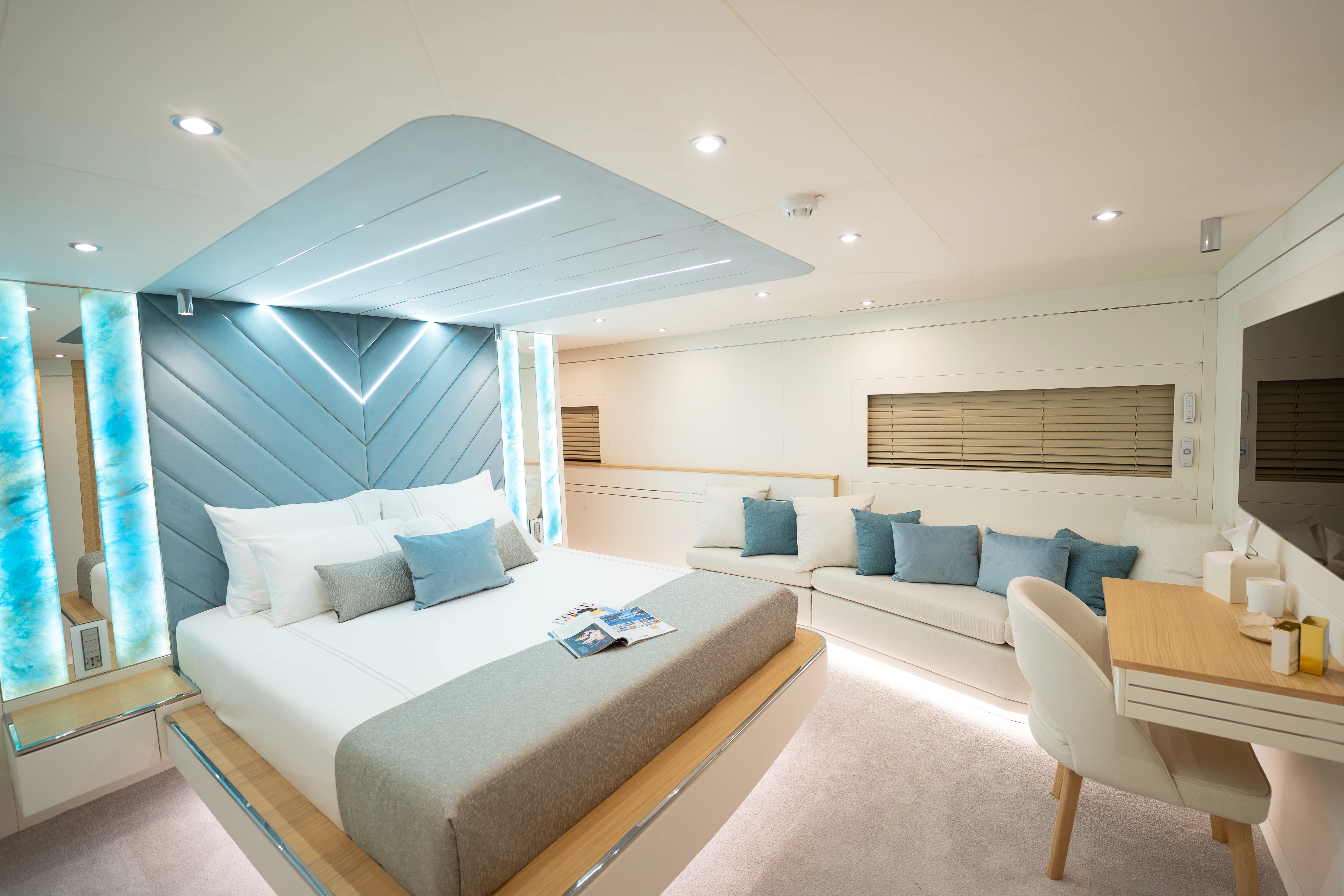 a large white bed in a room aboard RENATA Yacht for Charter