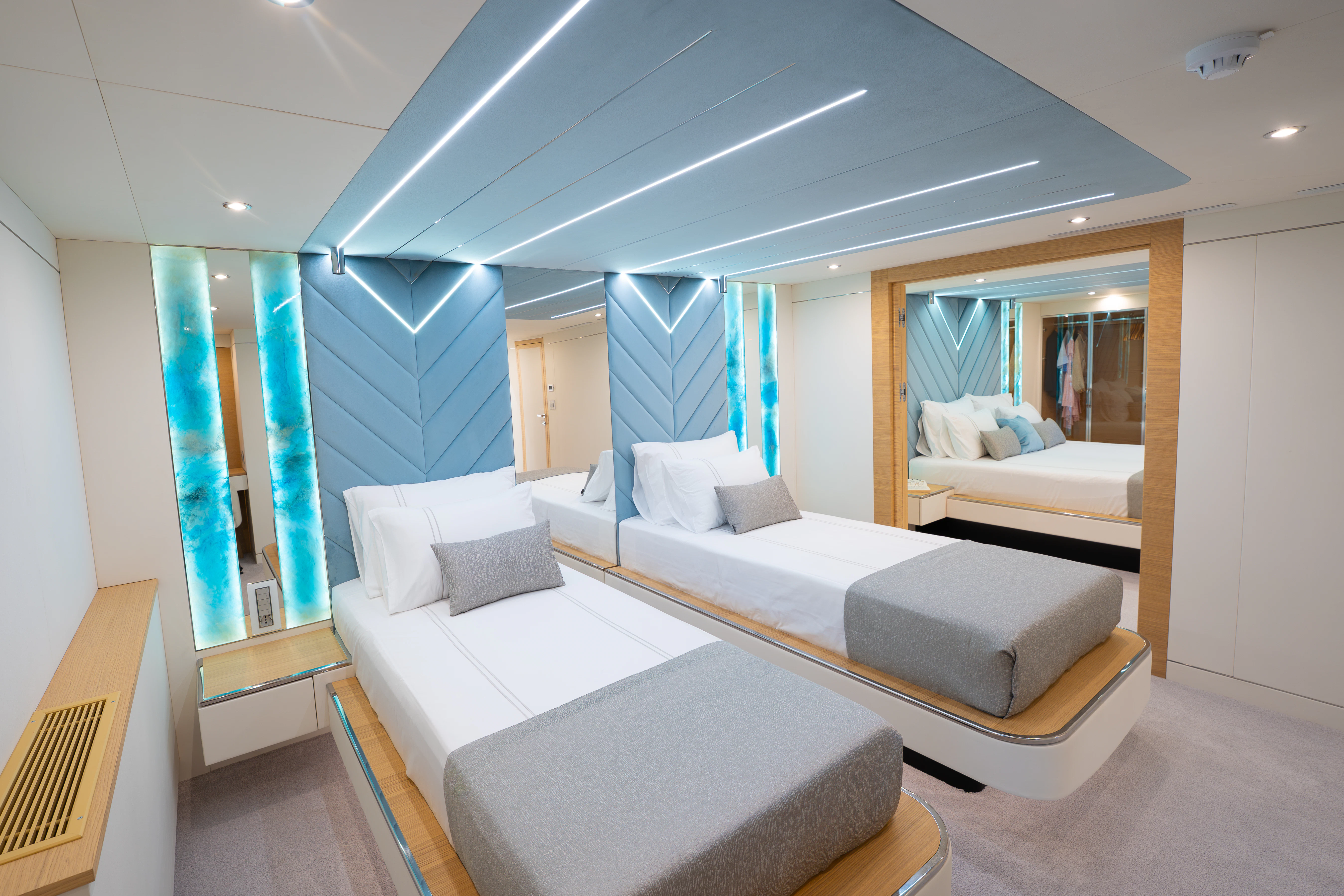 a room with a bed and a mirror aboard RENATA Yacht for Charter