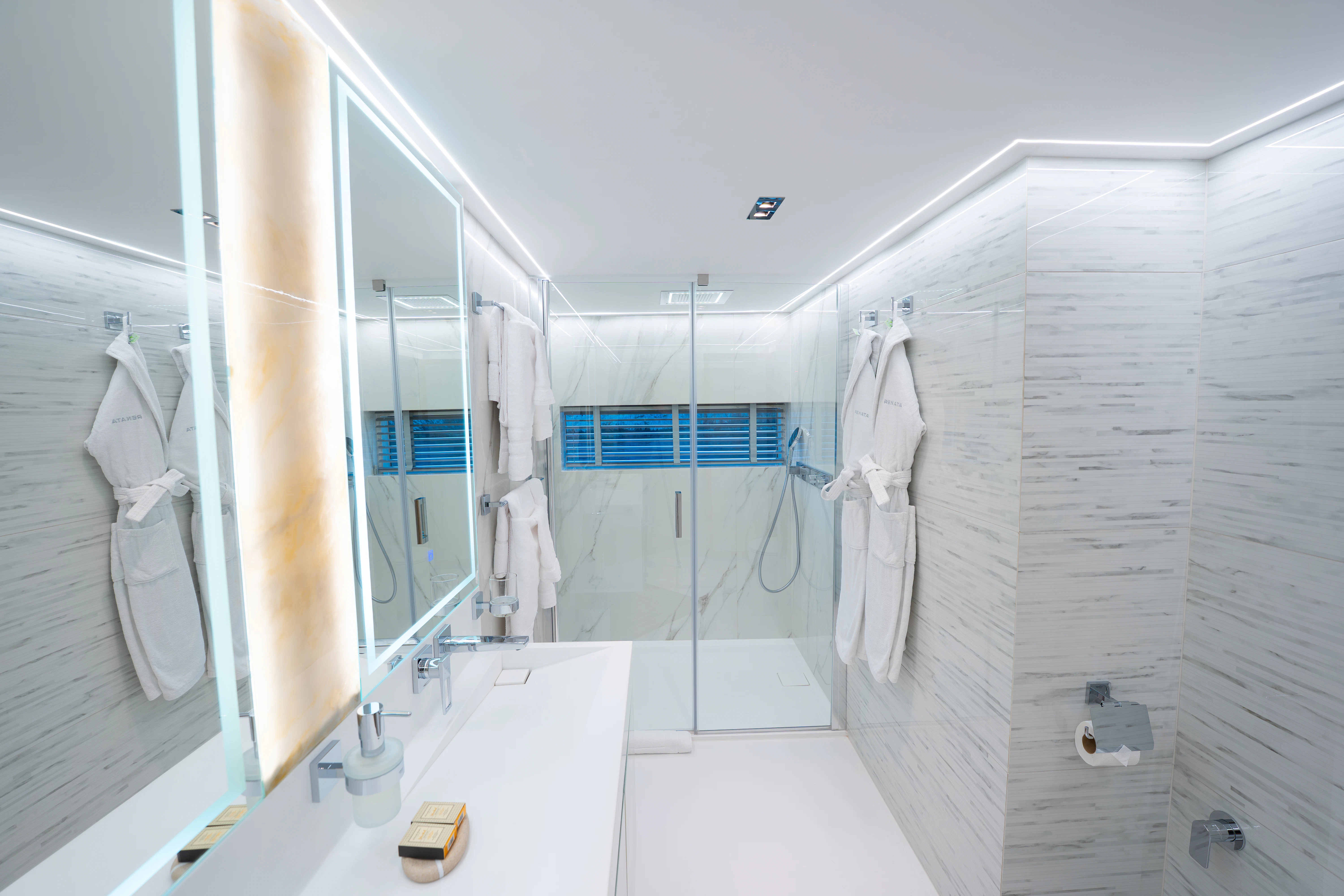 a bathroom with a shower unit and a sink aboard RENATA Yacht for Charter