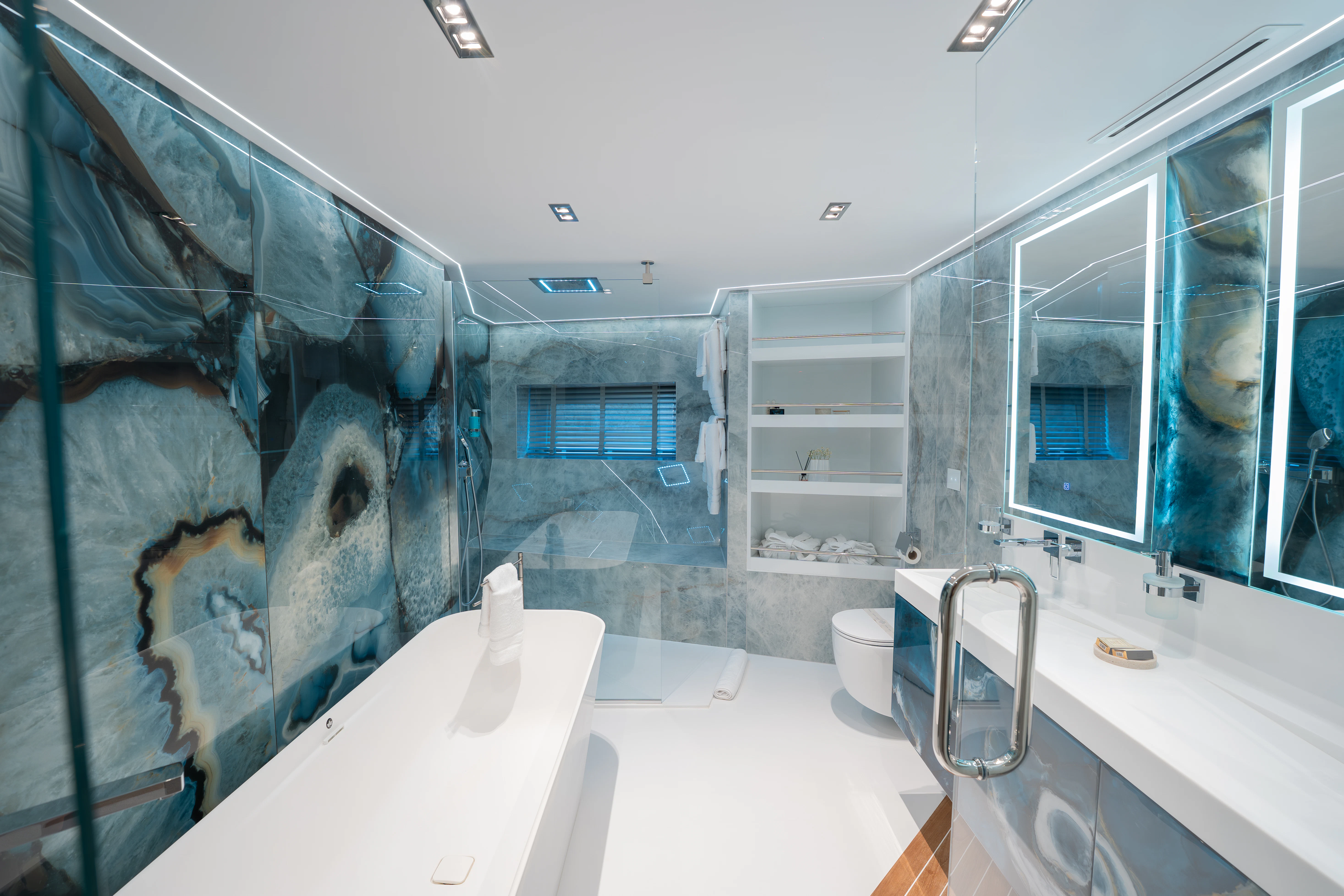 a bathroom with a tub and a sink aboard RENATA Yacht for Charter