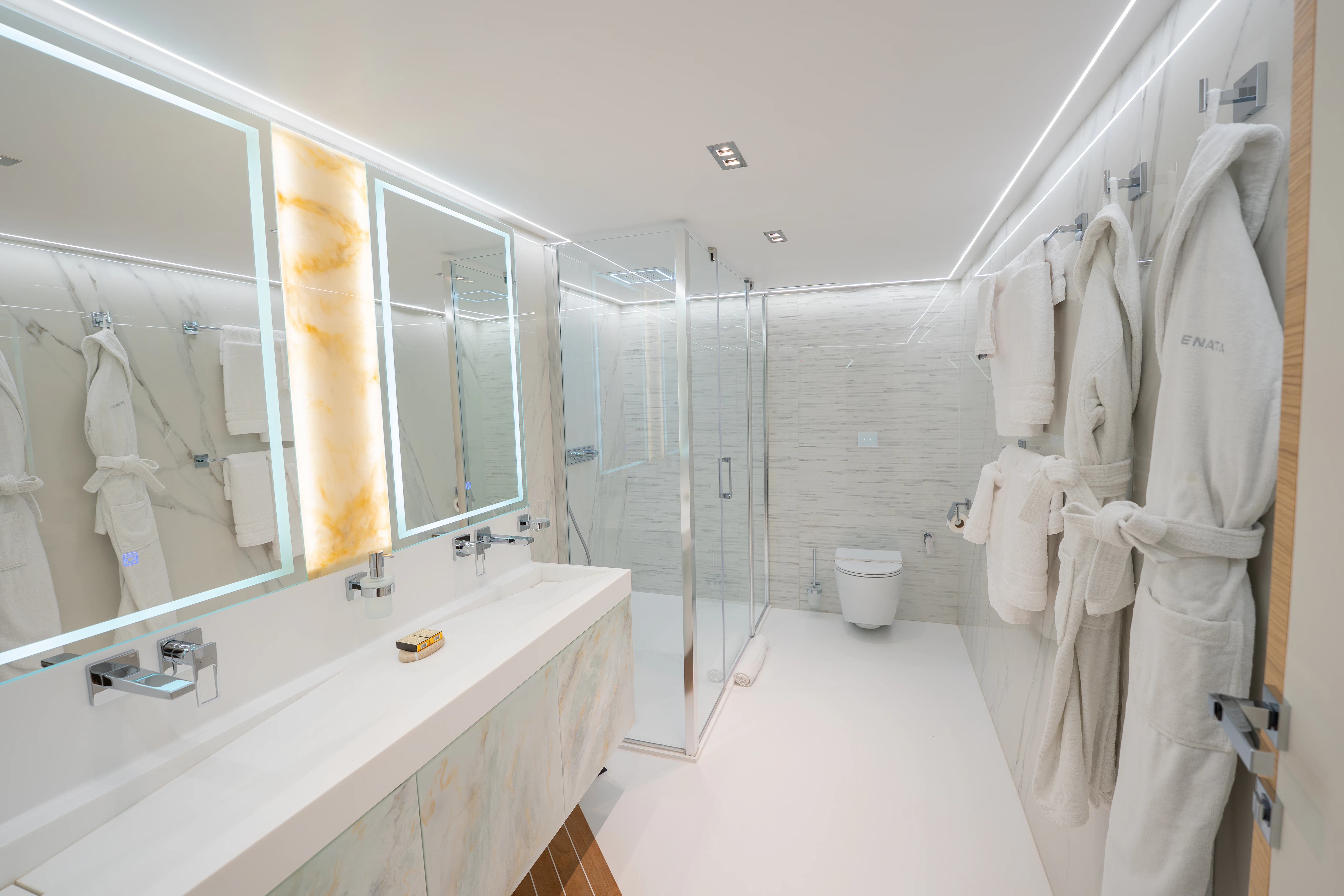 a bathroom with a large mirror aboard RENATA Yacht for Charter