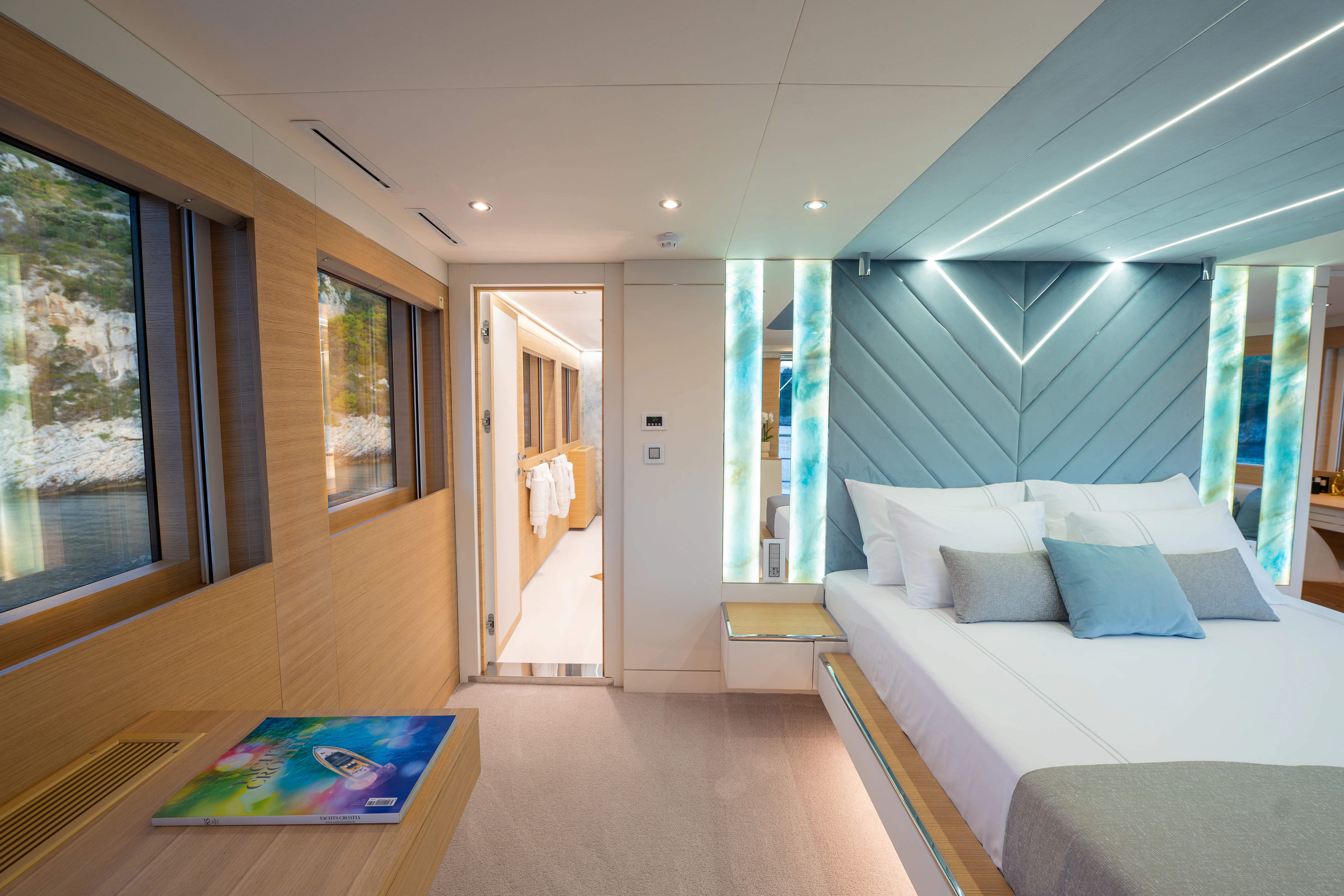 a room with a bed and a couch aboard RENATA Yacht for Charter