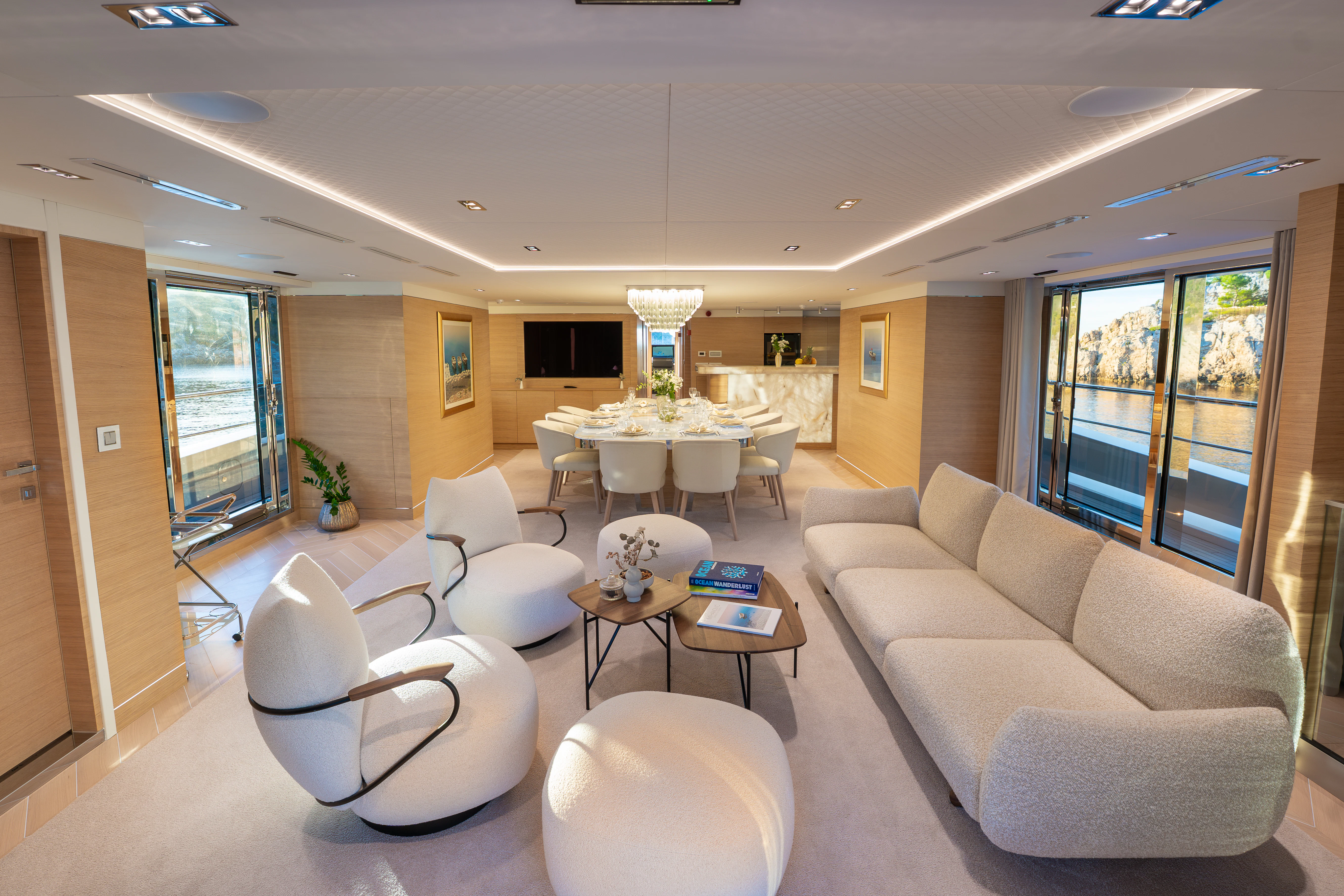 a living room with white furniture aboard RENATA Yacht for Charter