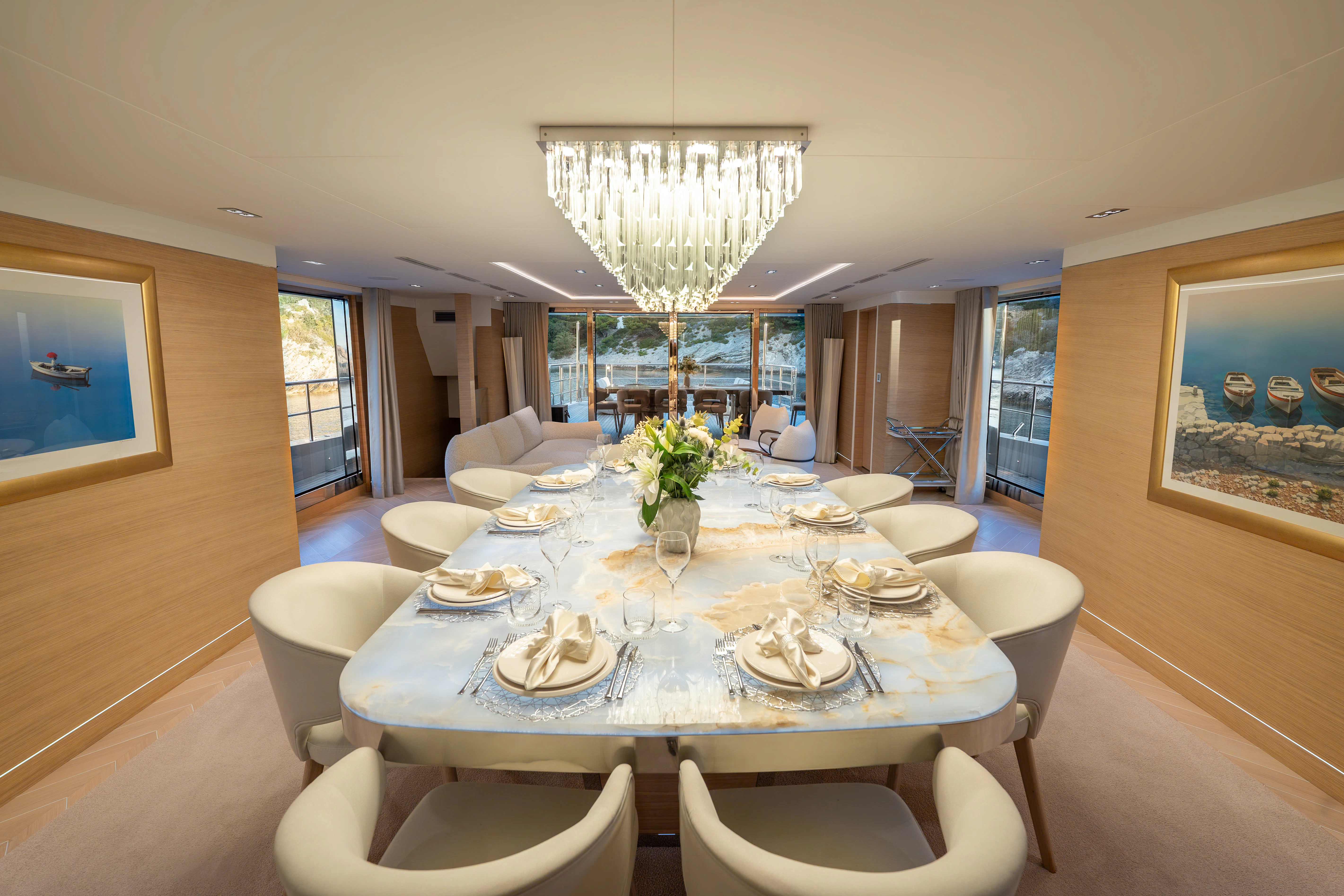 a large dining room with a large table and chairs aboard RENATA Yacht for Charter