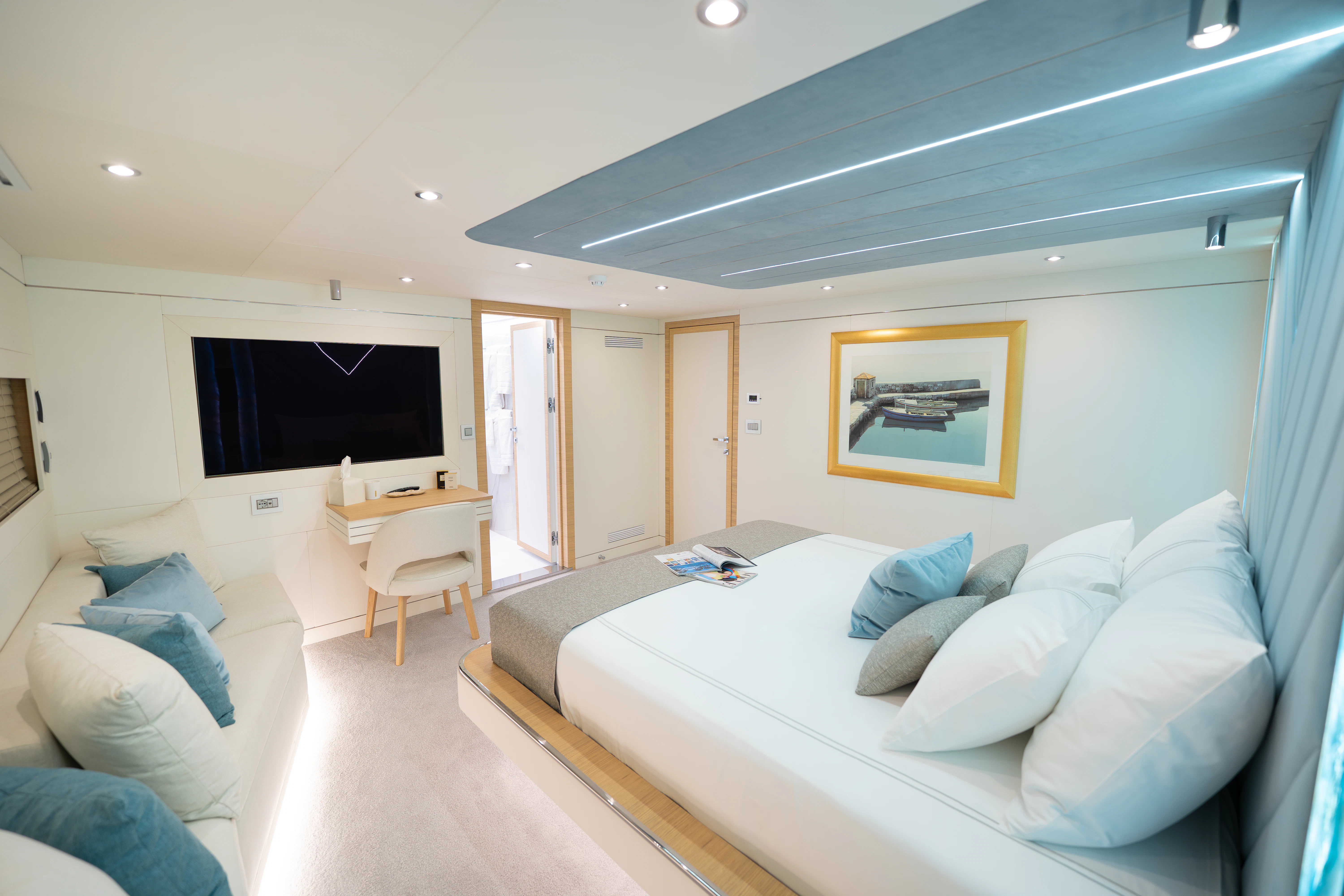 a large white bed in a room aboard RENATA Yacht for Charter