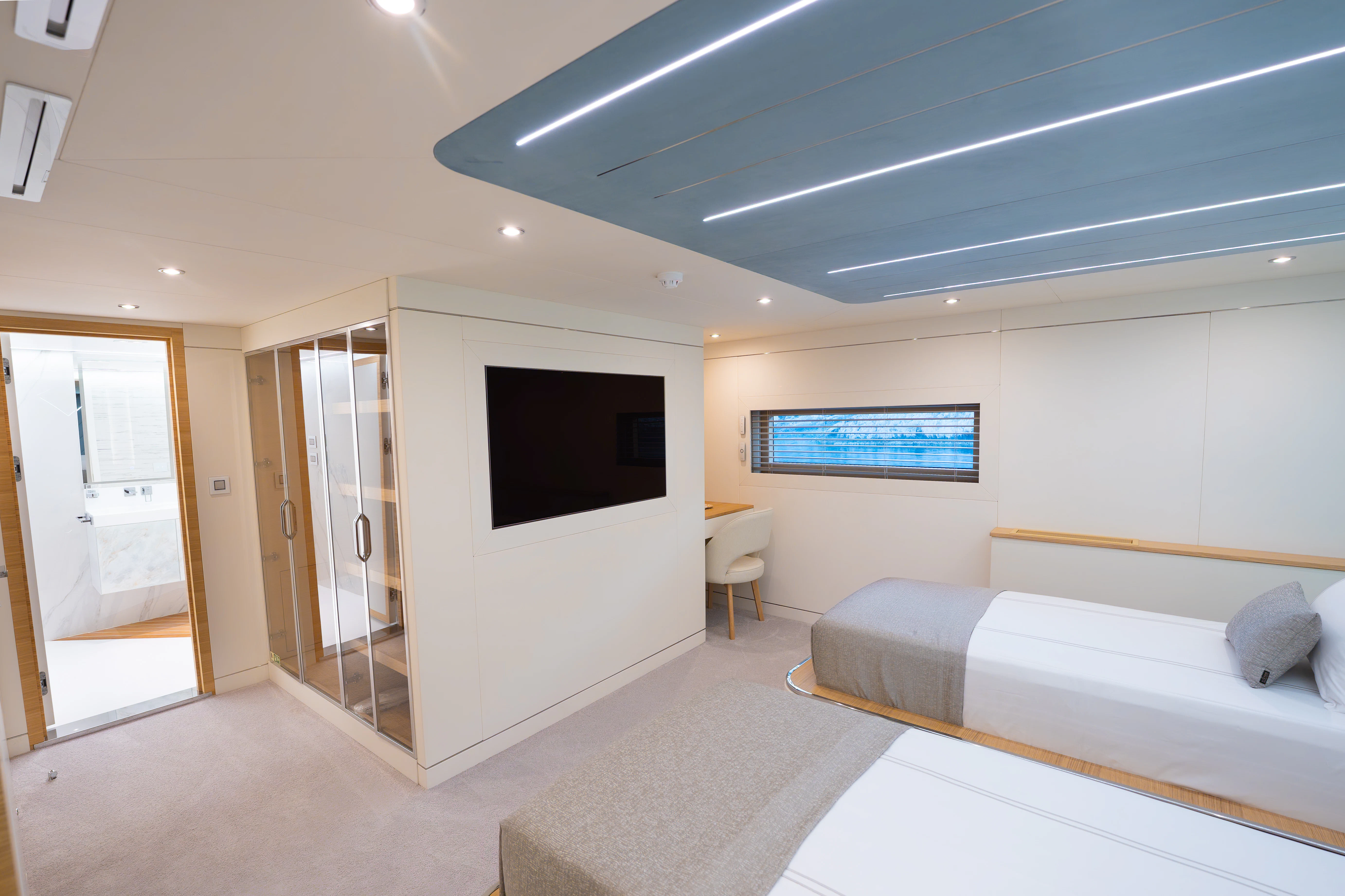 a room with a bed and a tv aboard RENATA Yacht for Charter