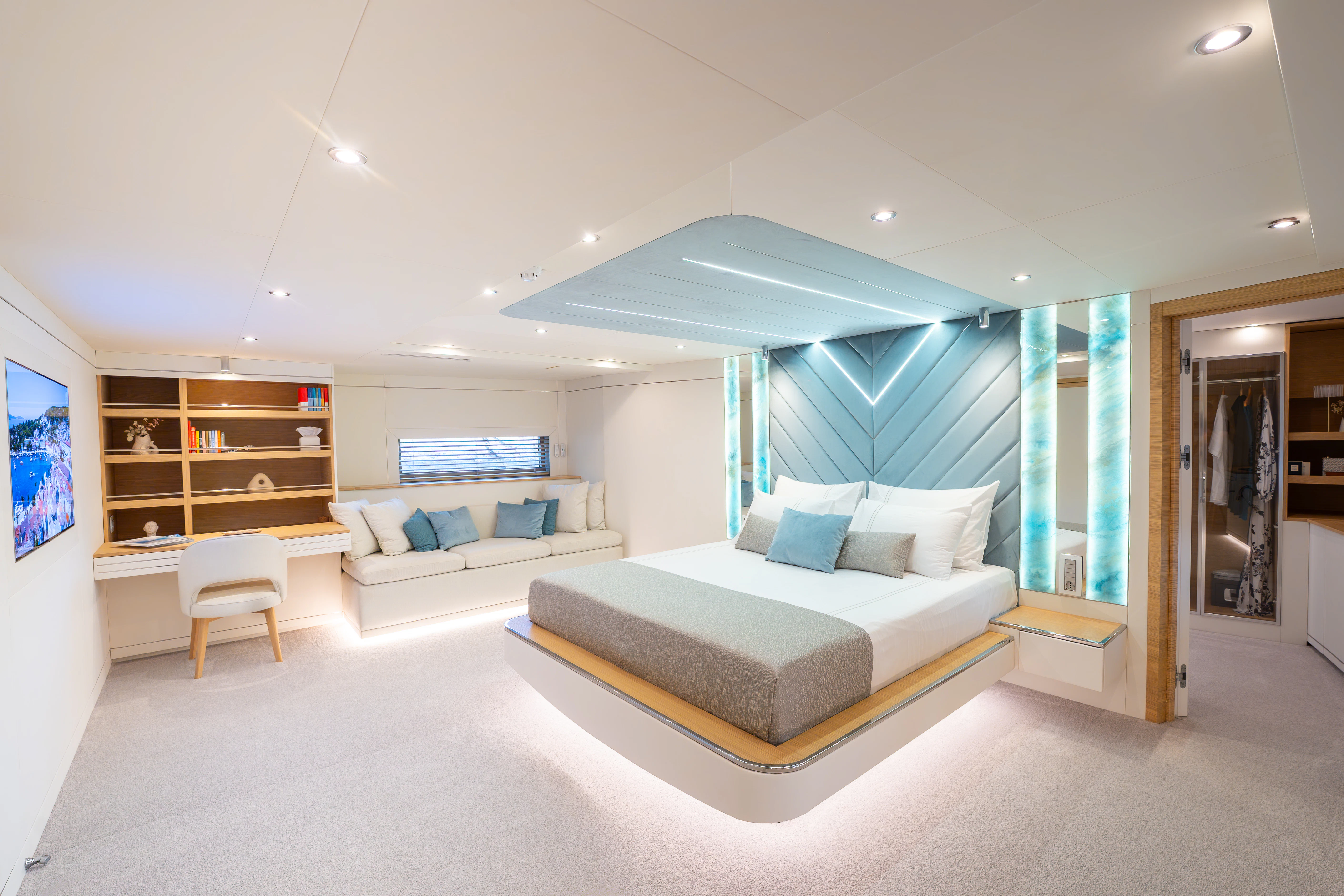 a room with a couch and a table and a window aboard RENATA Yacht for Charter