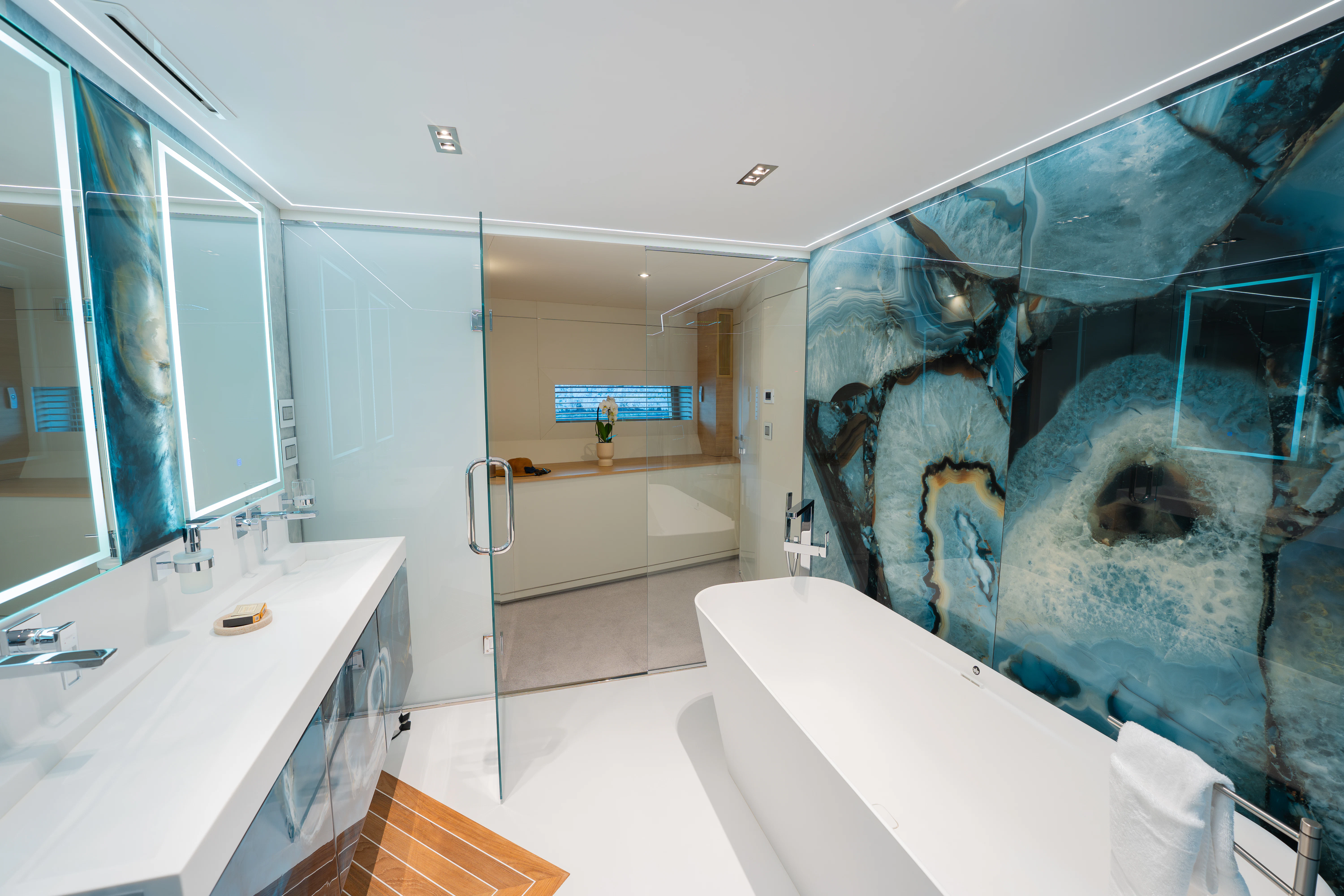 a large bathroom with a large glass shower aboard RENATA Yacht for Charter