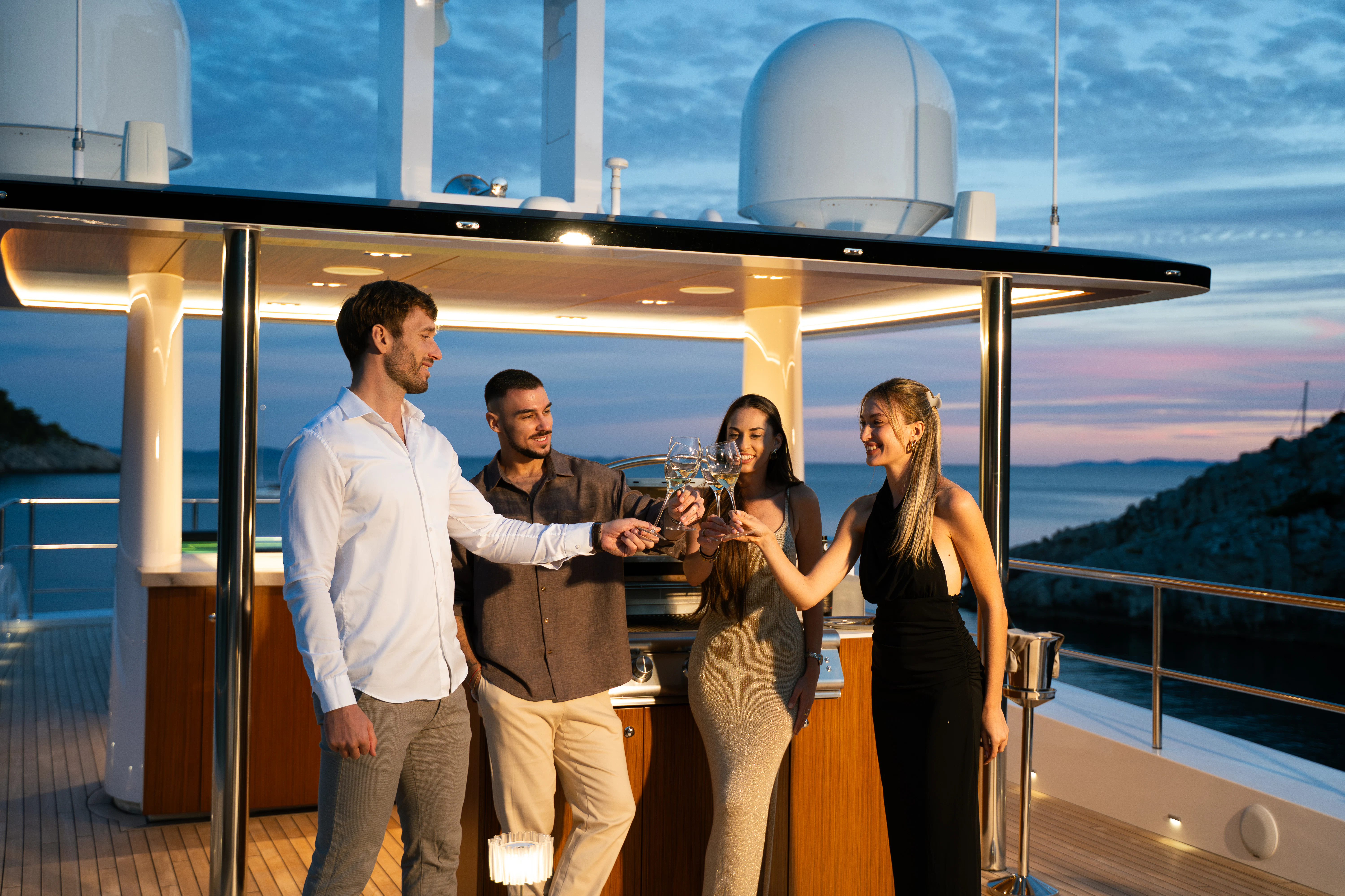 a group of people drinking wine aboard RENATA Yacht for Charter