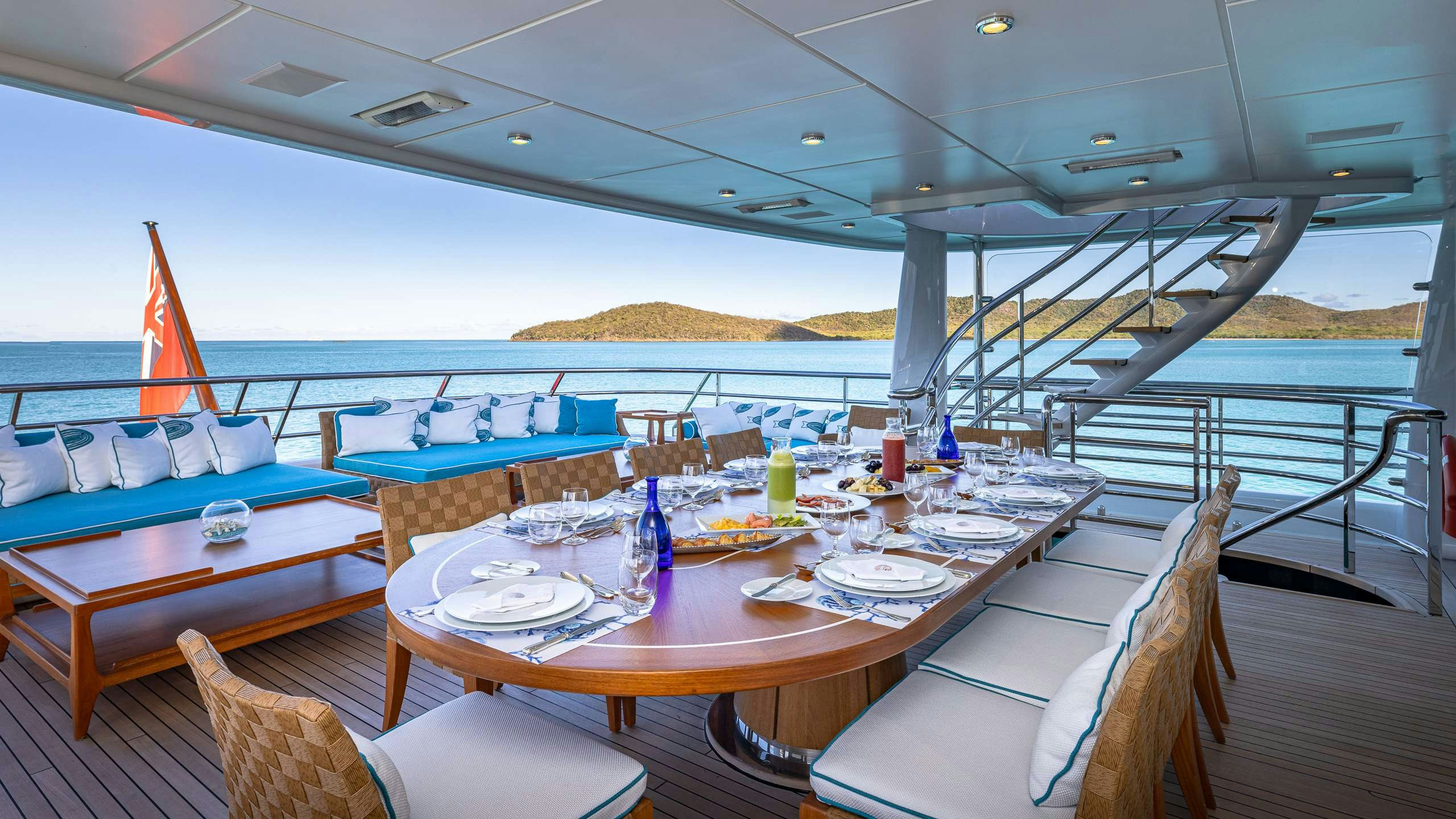 a table set for a meal on a boat aboard DEEP BLUE Yacht for Charter