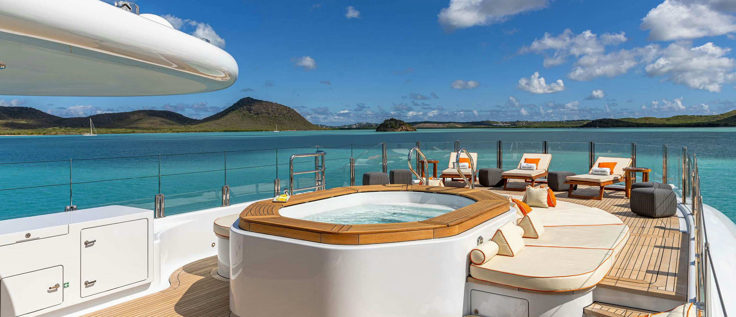 a large white boat on a dock aboard DEEP BLUE Yacht for Charter