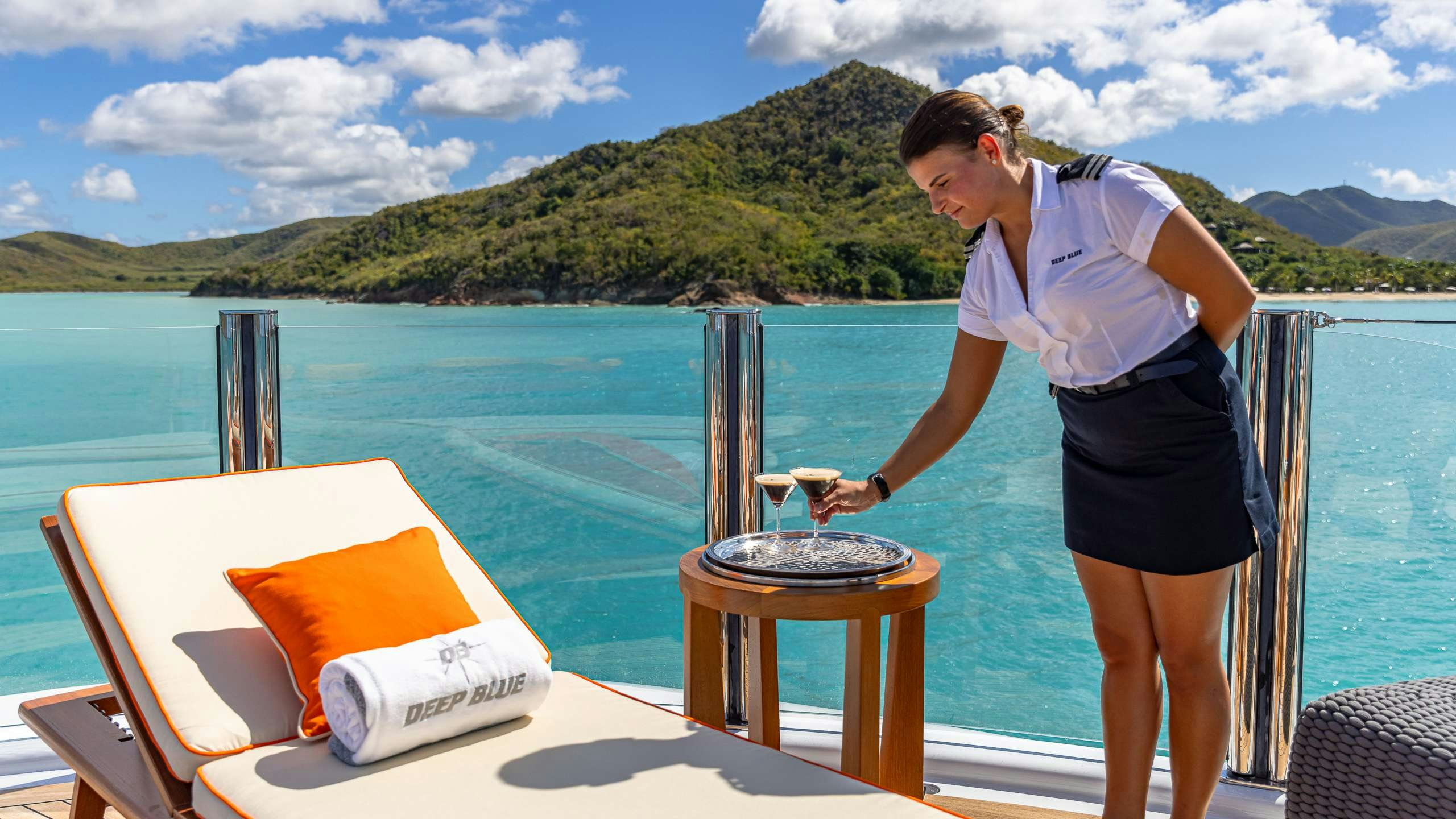 a woman cooking on a grill aboard DEEP BLUE Yacht for Charter