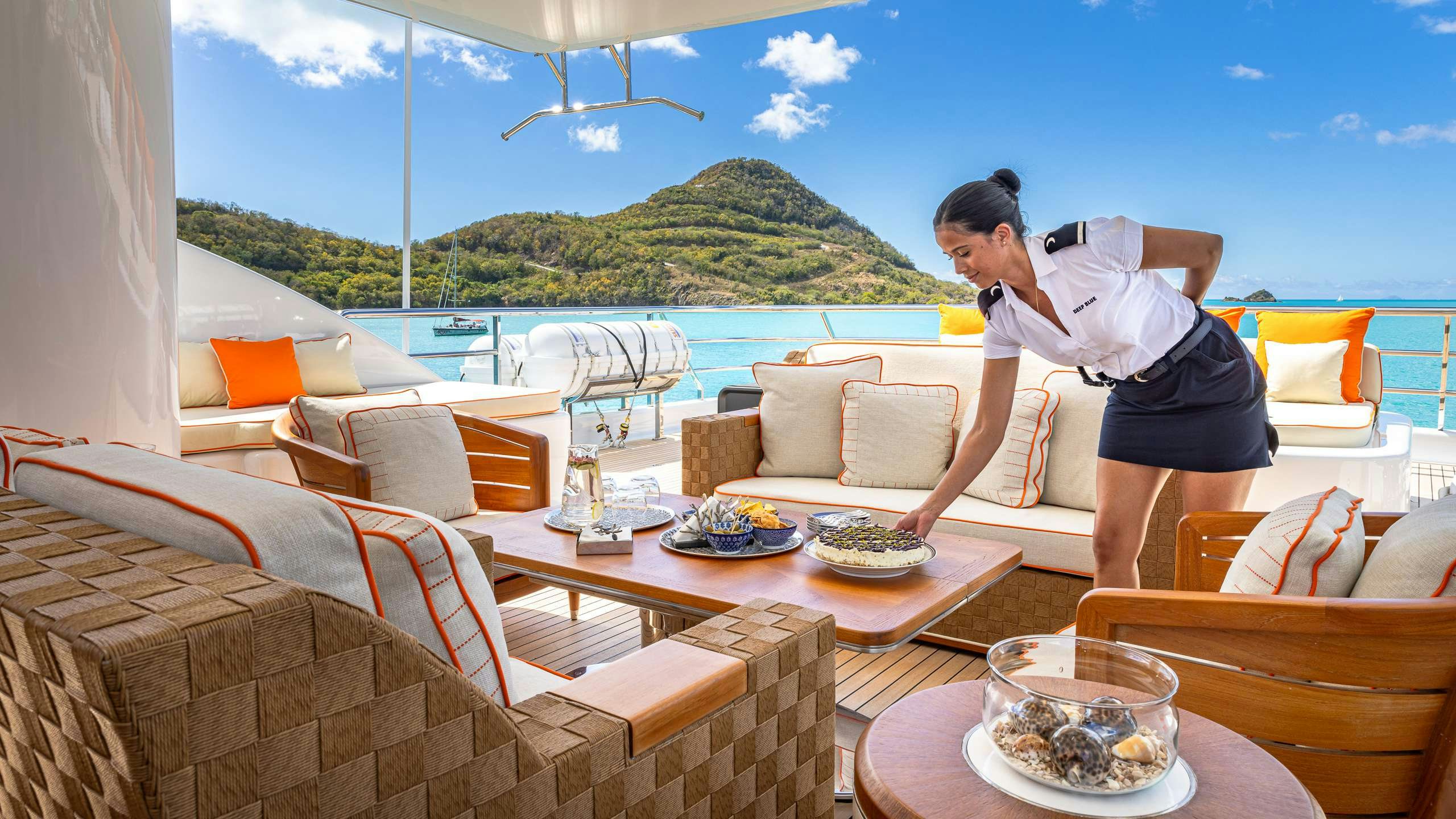 a person standing on a balcony aboard DEEP BLUE Yacht for Charter
