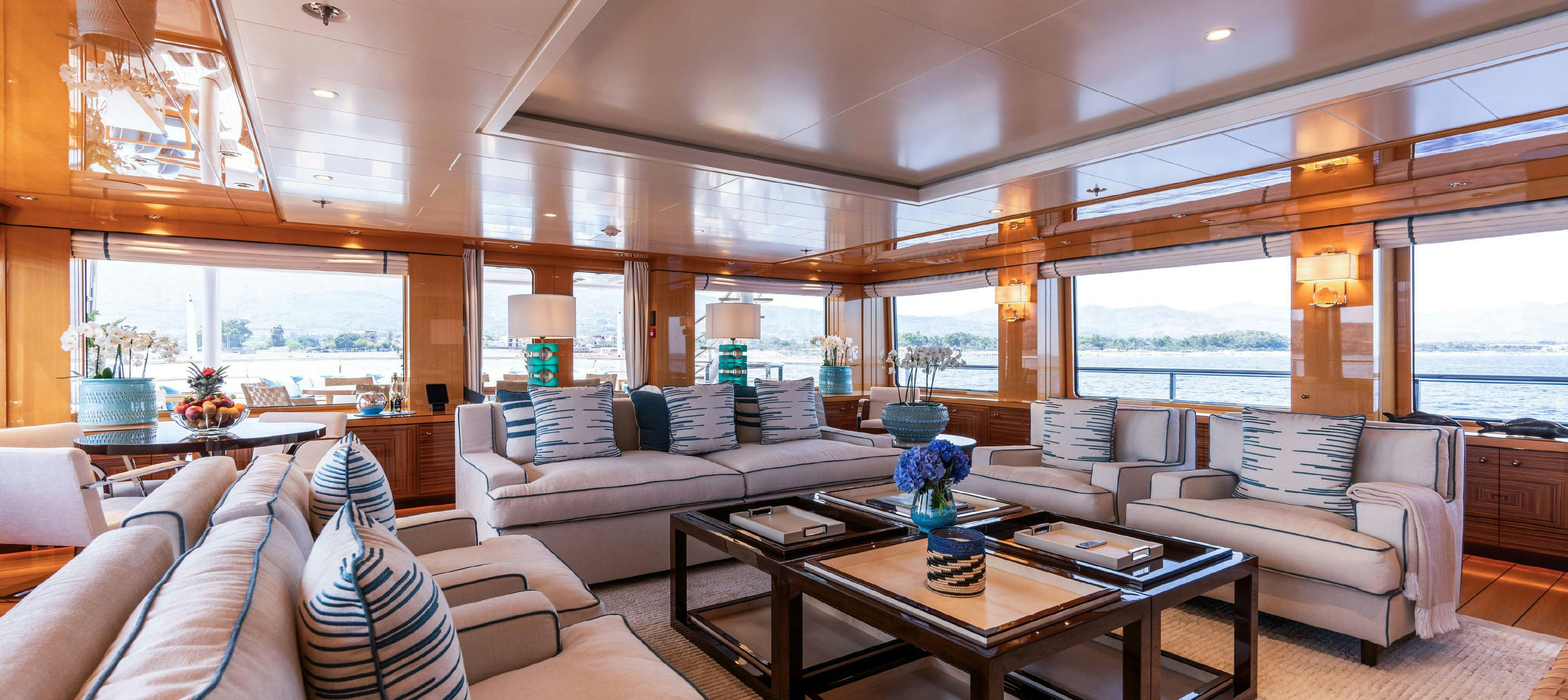 a living room with a large window aboard DEEP BLUE Yacht for Charter