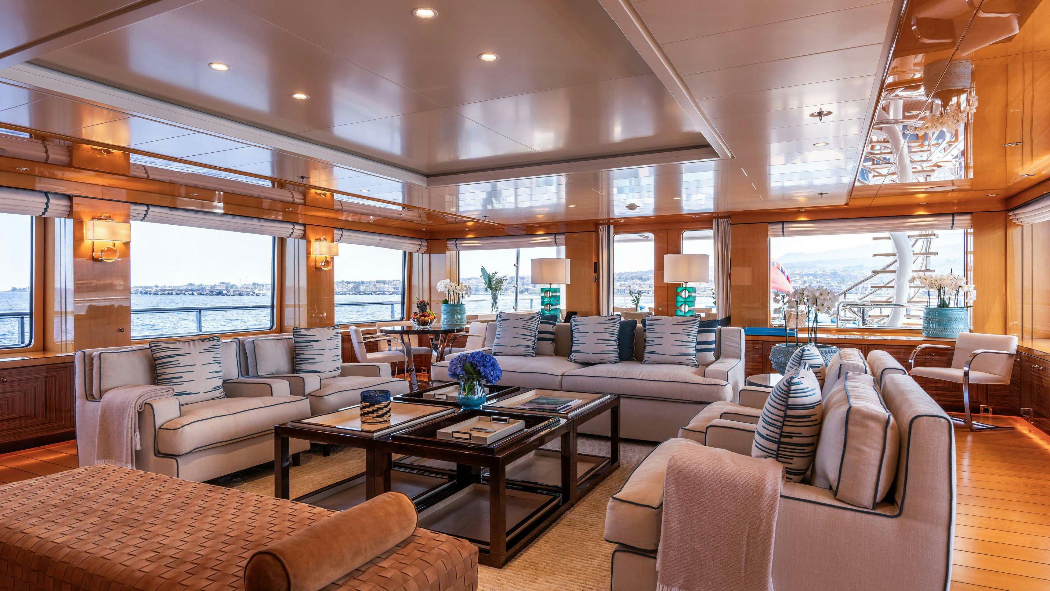 a living room with a large window aboard DEEP BLUE Yacht for Charter