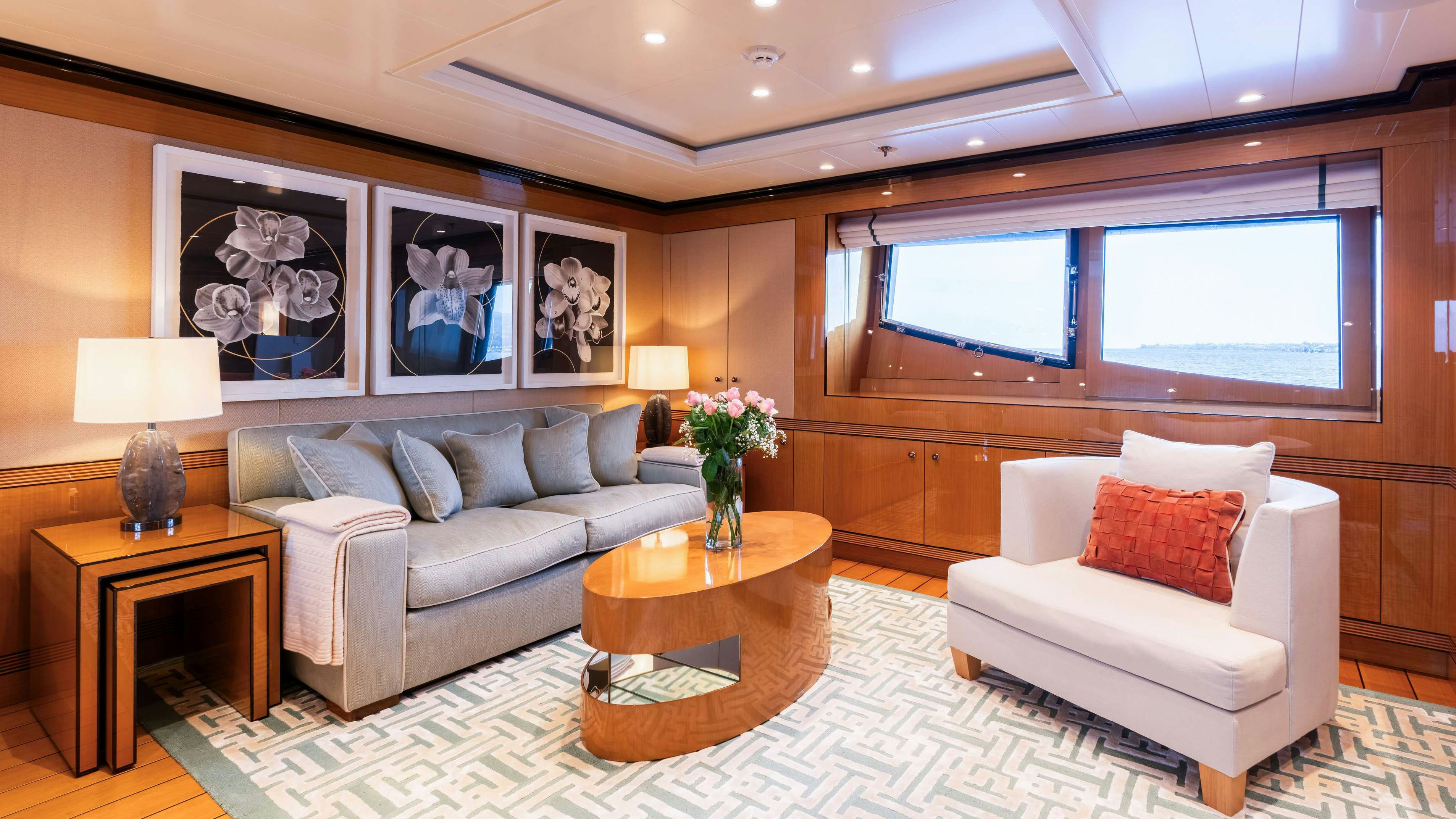 a living room with a couch and a coffee table aboard DEEP BLUE Yacht for Charter