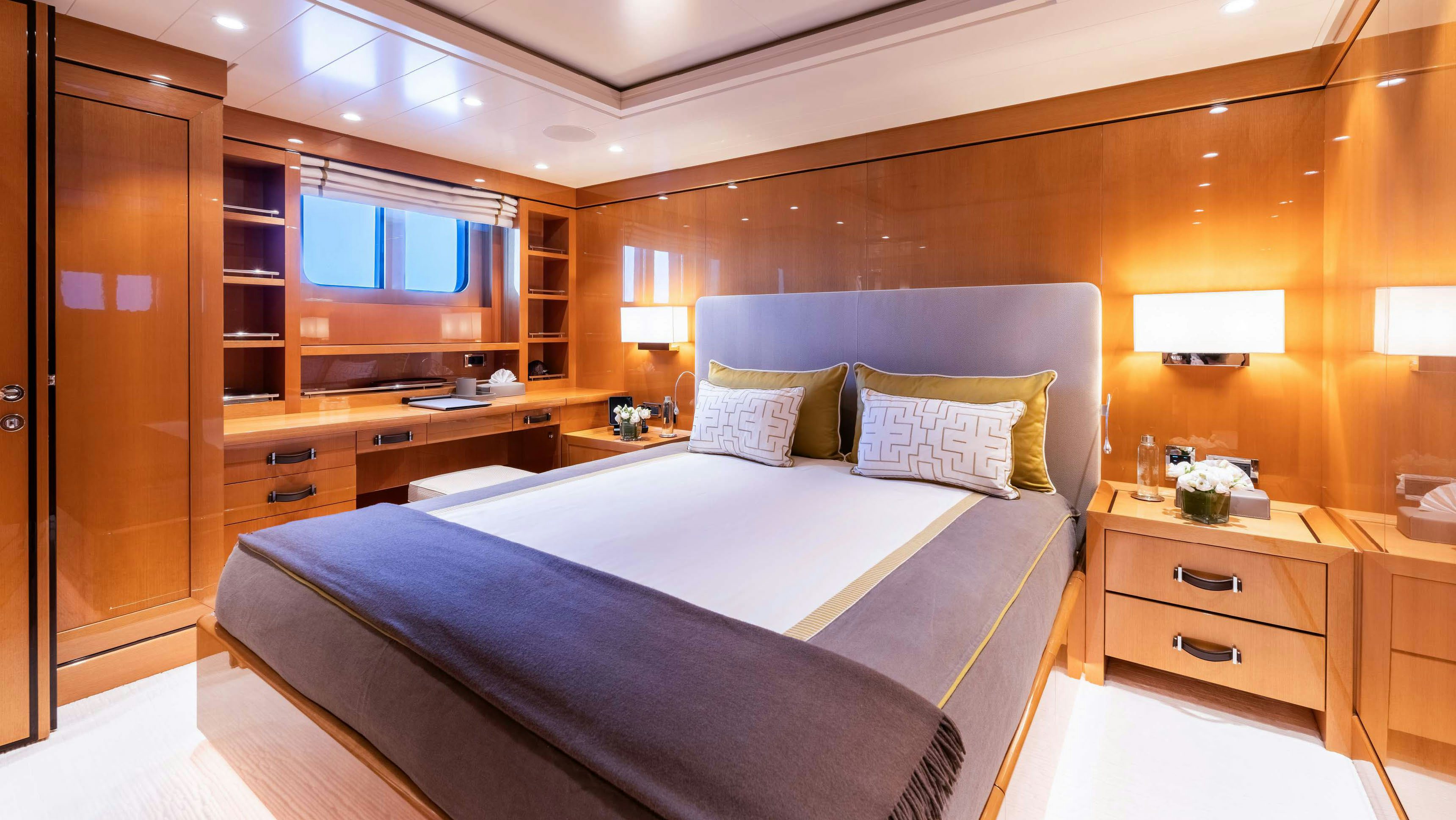 a hotel room with a bed and a desk aboard DEEP BLUE Yacht for Charter
