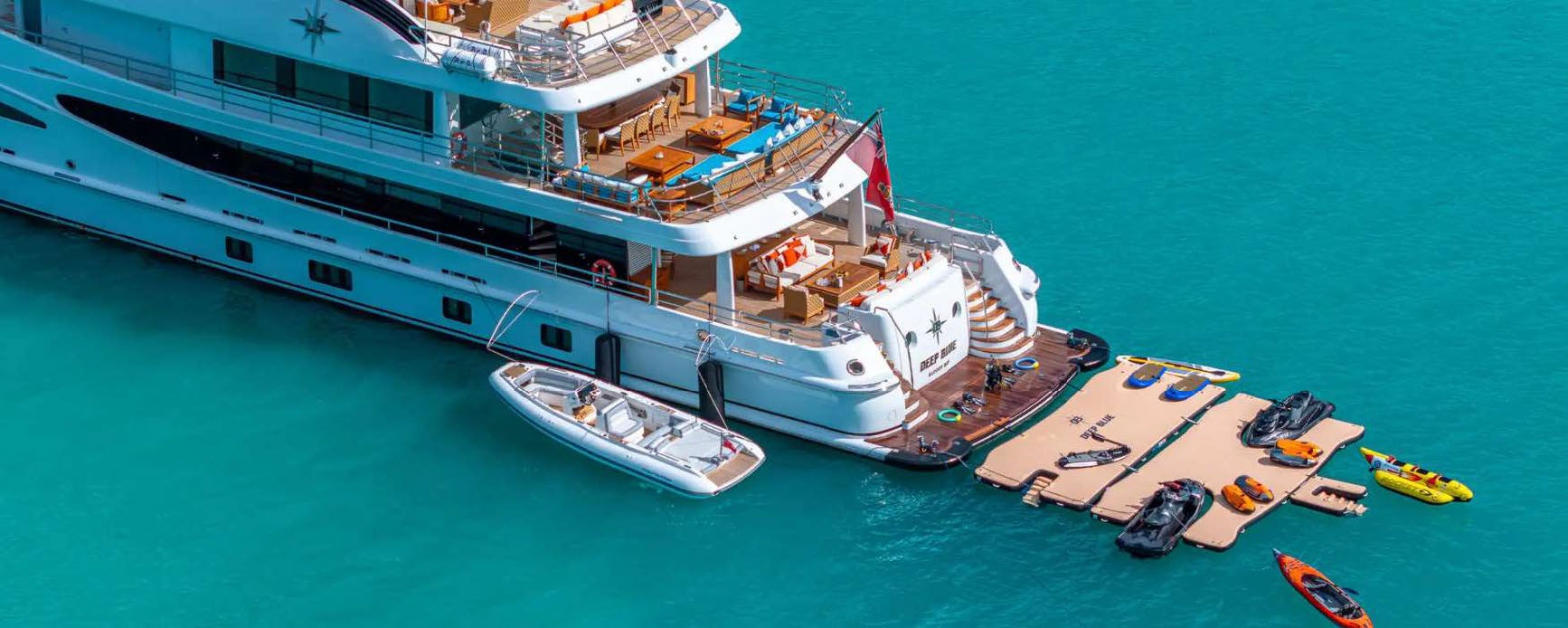 a large white boat with a dock aboard DEEP BLUE Yacht for Charter