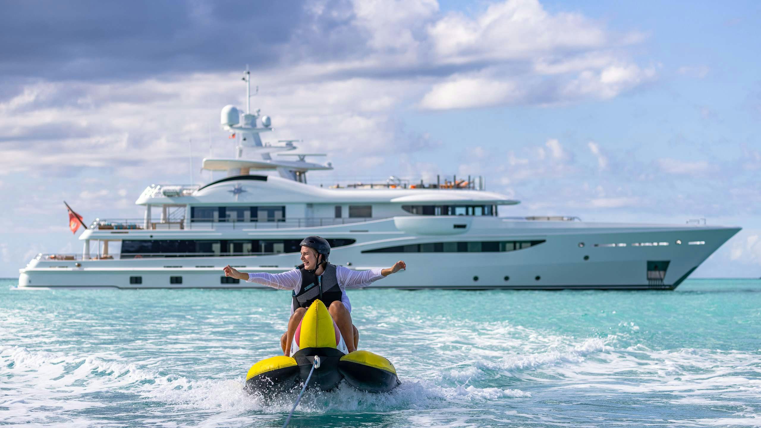 a man on a jet ski aboard DEEP BLUE Yacht for Charter