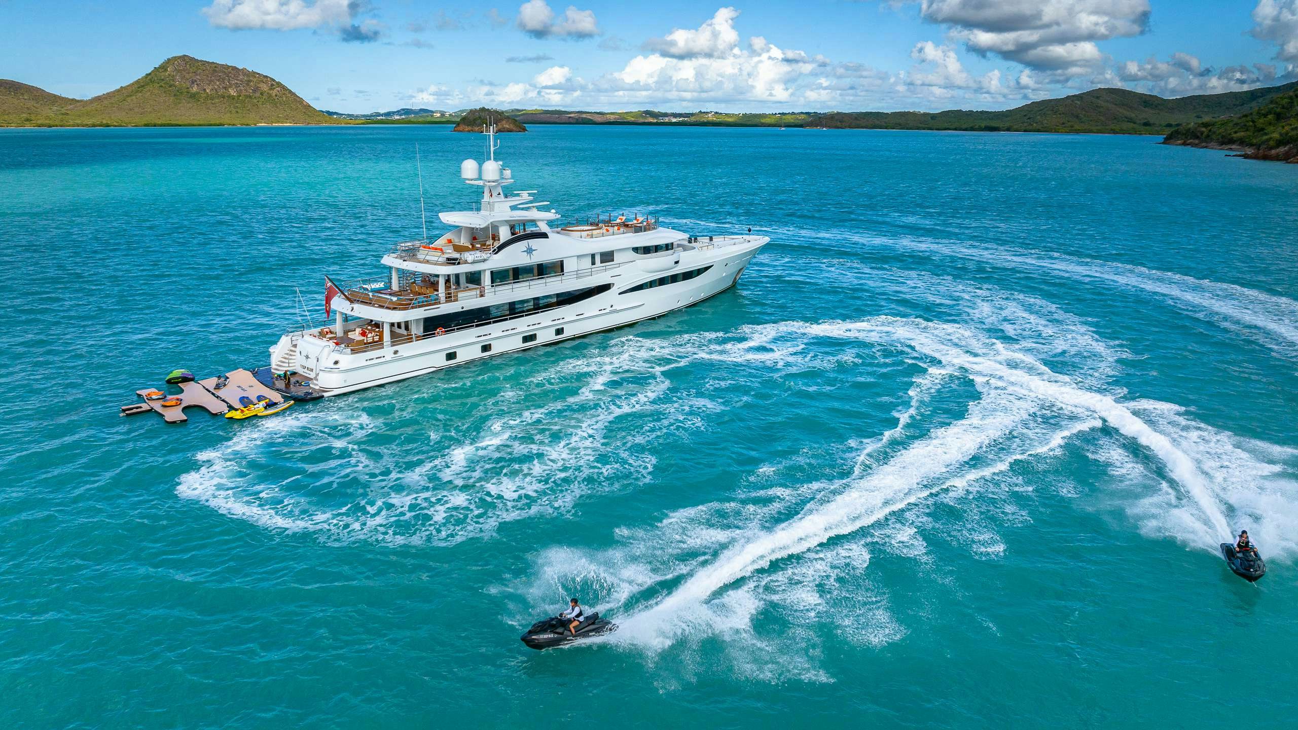 a large ship with a boat on it aboard DEEP BLUE Yacht for Charter