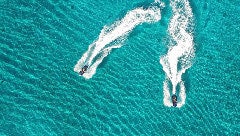 a person surfing on the sea aboard DEEP BLUE Yacht for Charter