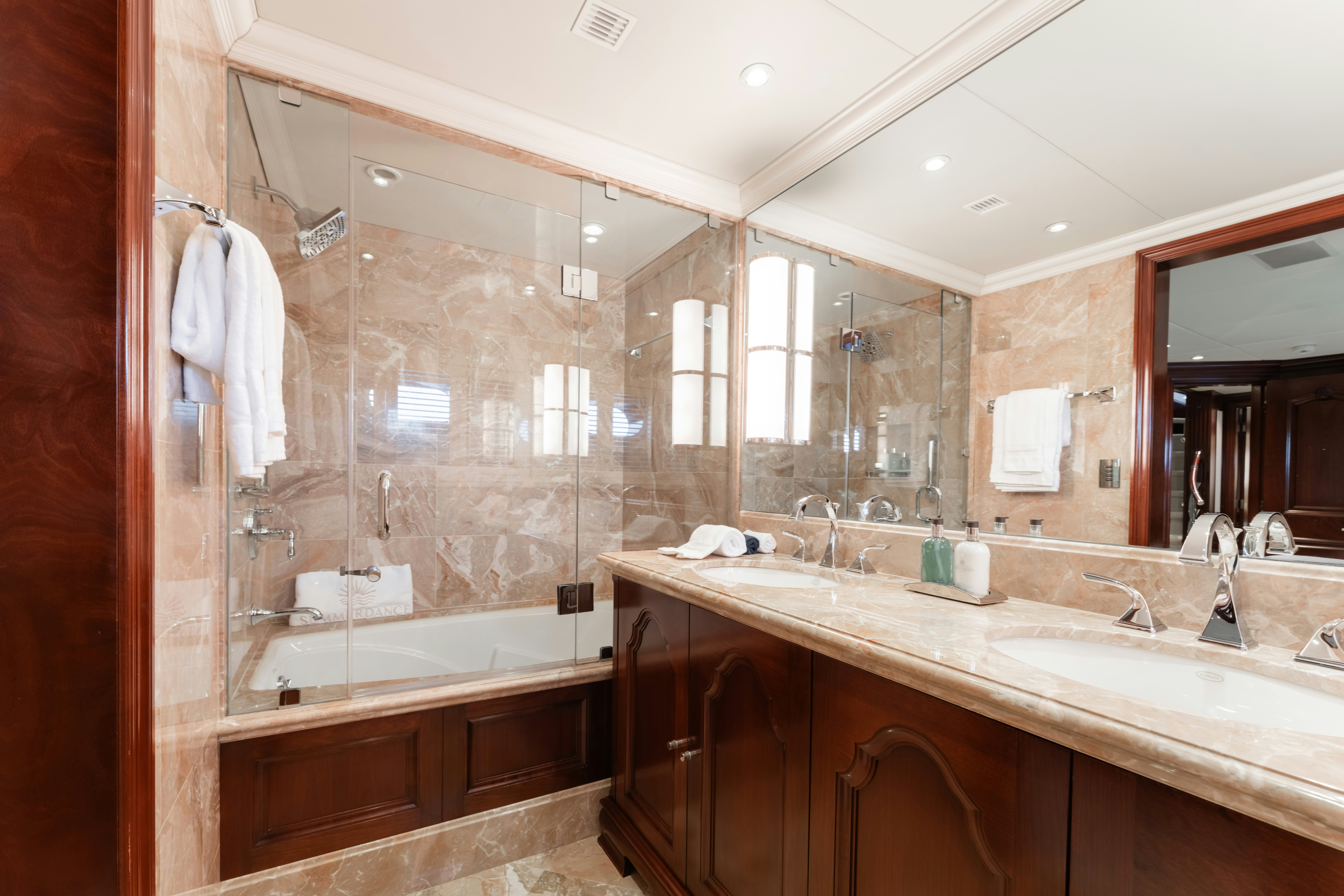 a bathroom with a large mirror aboard SUMMERDANCE Yacht for Sale