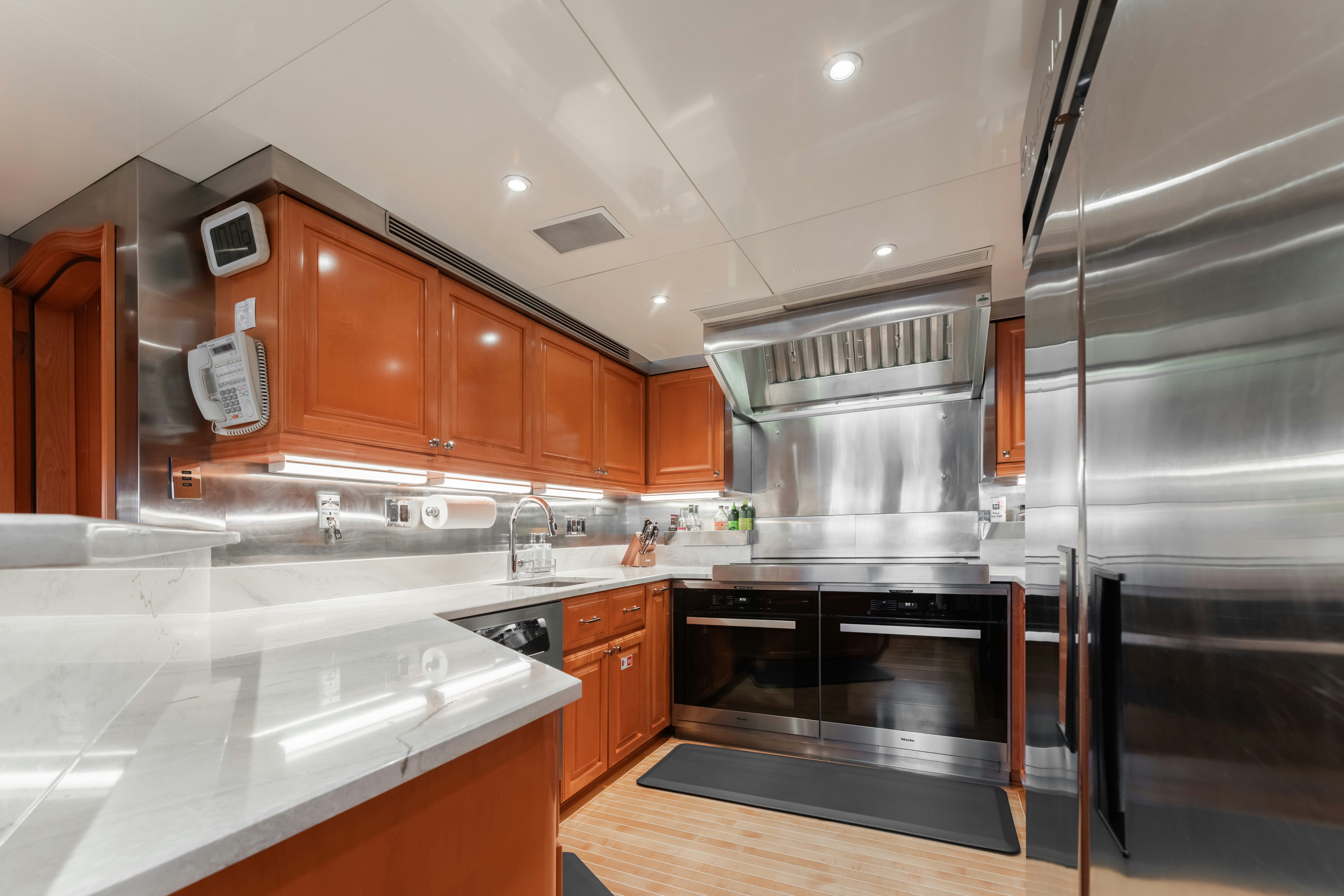 a kitchen with a stainless steel stove aboard SUMMERDANCE Yacht for Sale
